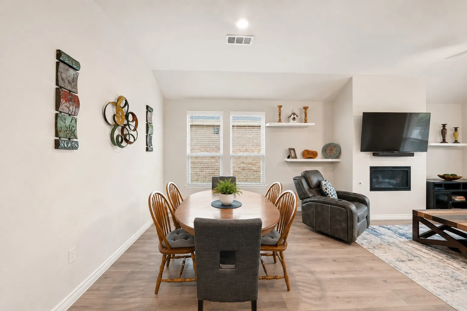 Wood-finish flooring, recessed lighting, and built-in shelving