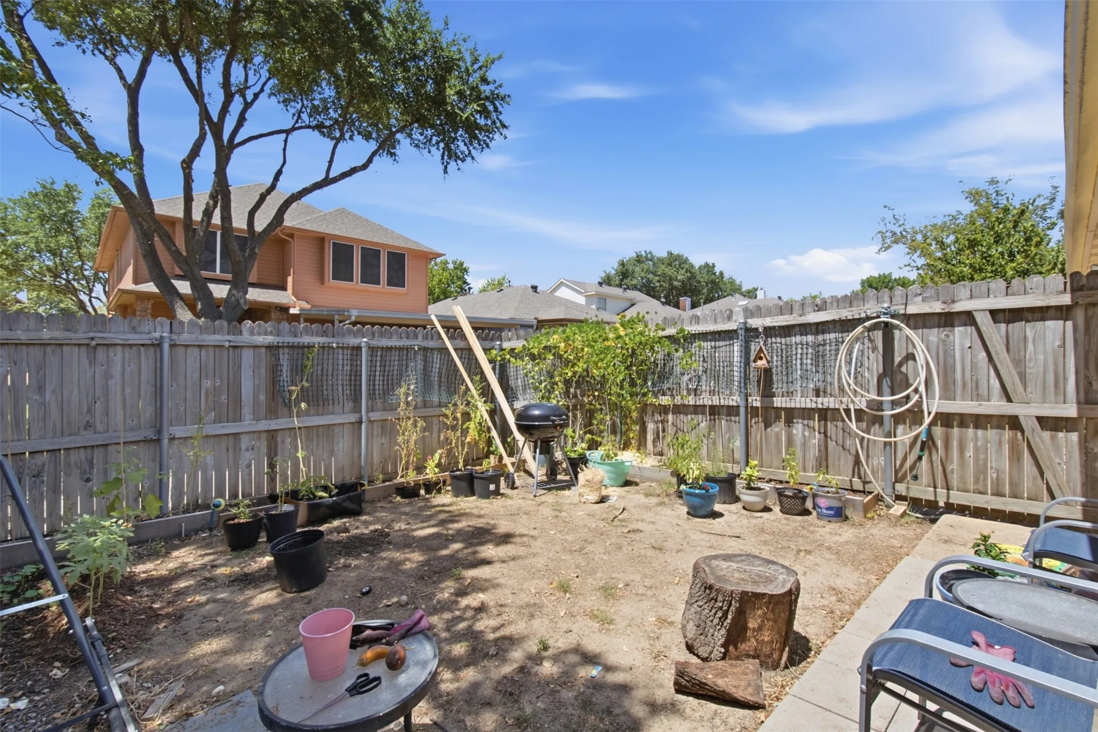 Private backyard with wood fencing and a concrete patio