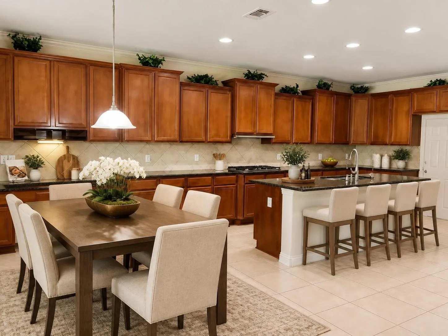Spacious kitchen featuring extensive cabinetry, dark countertops, a large island with seating, a tile backsplash, and recessed lighting