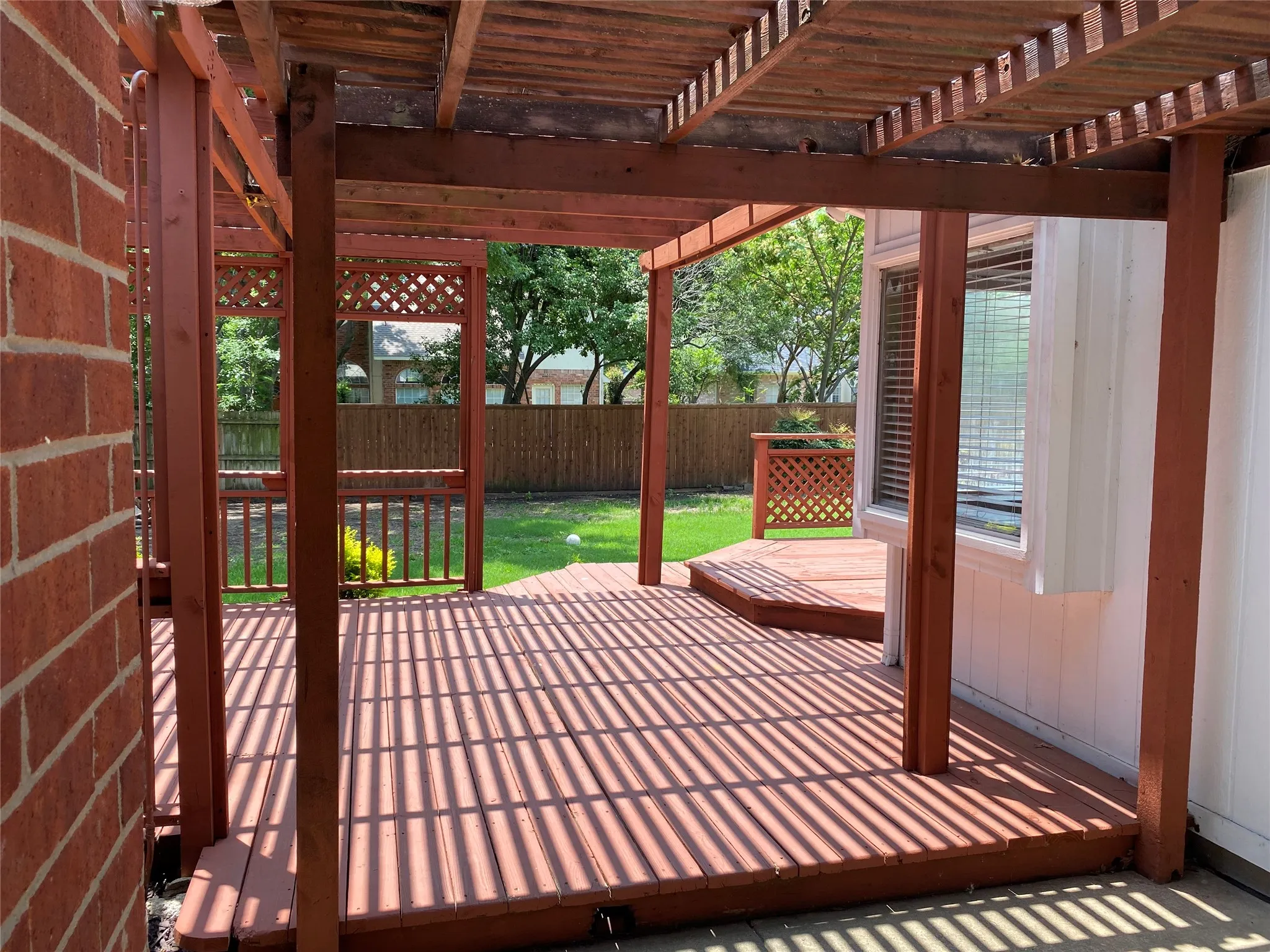 From Back door looking toward the Decking and yard