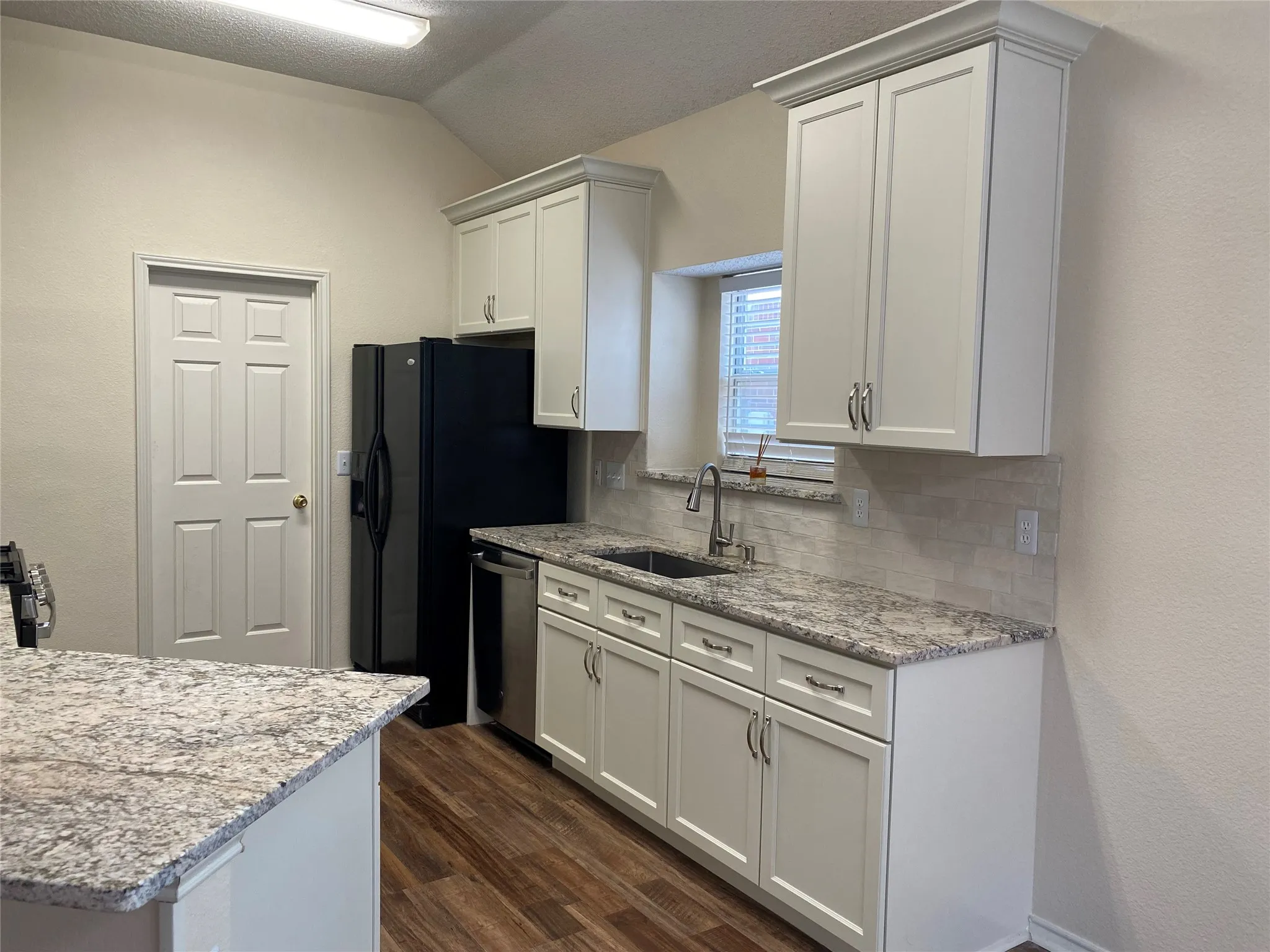 Kitchen showing Granite counters and Farm Sink