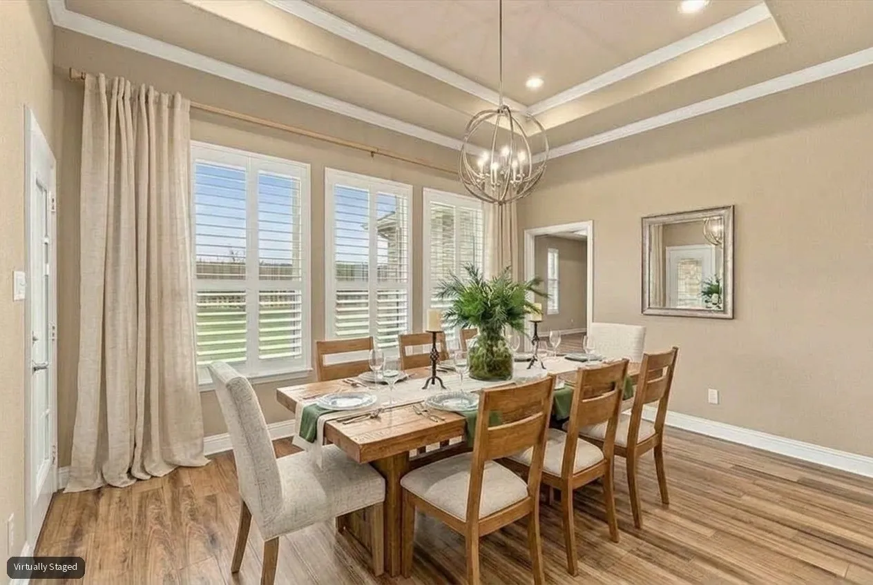 Virtually Staged Dining Area next to kitchen overlooking beautiful backyard.