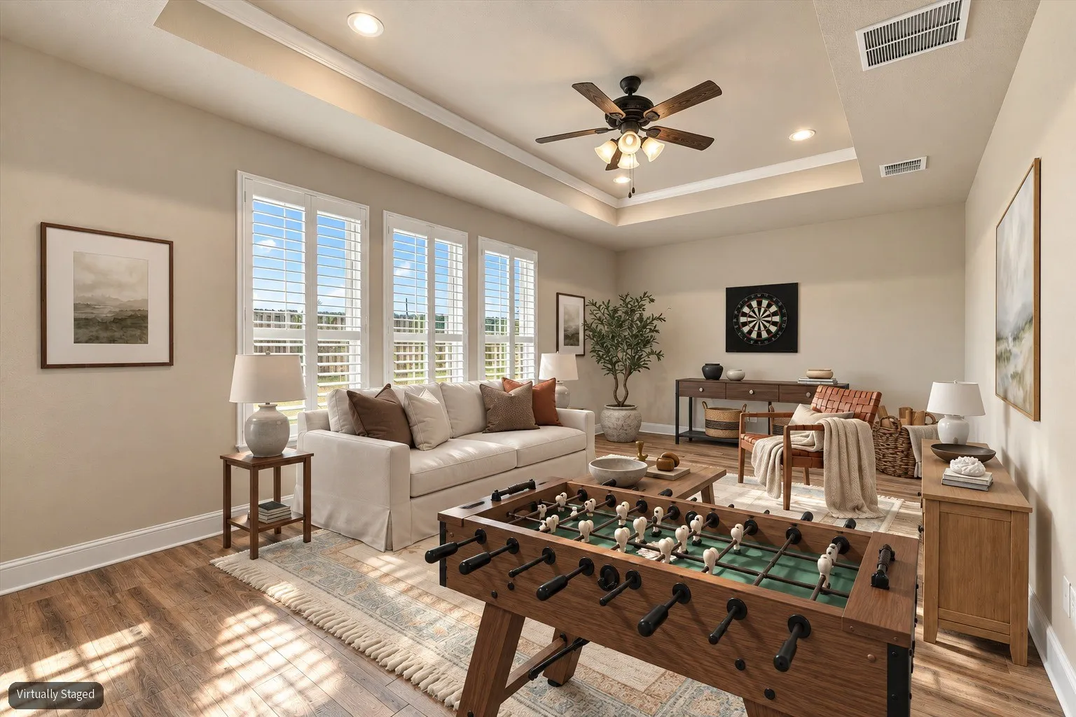 Virtually Staged. Game room behind dining area. Great flex space for a multitude or activities or could be used as a large 4th bedroom!