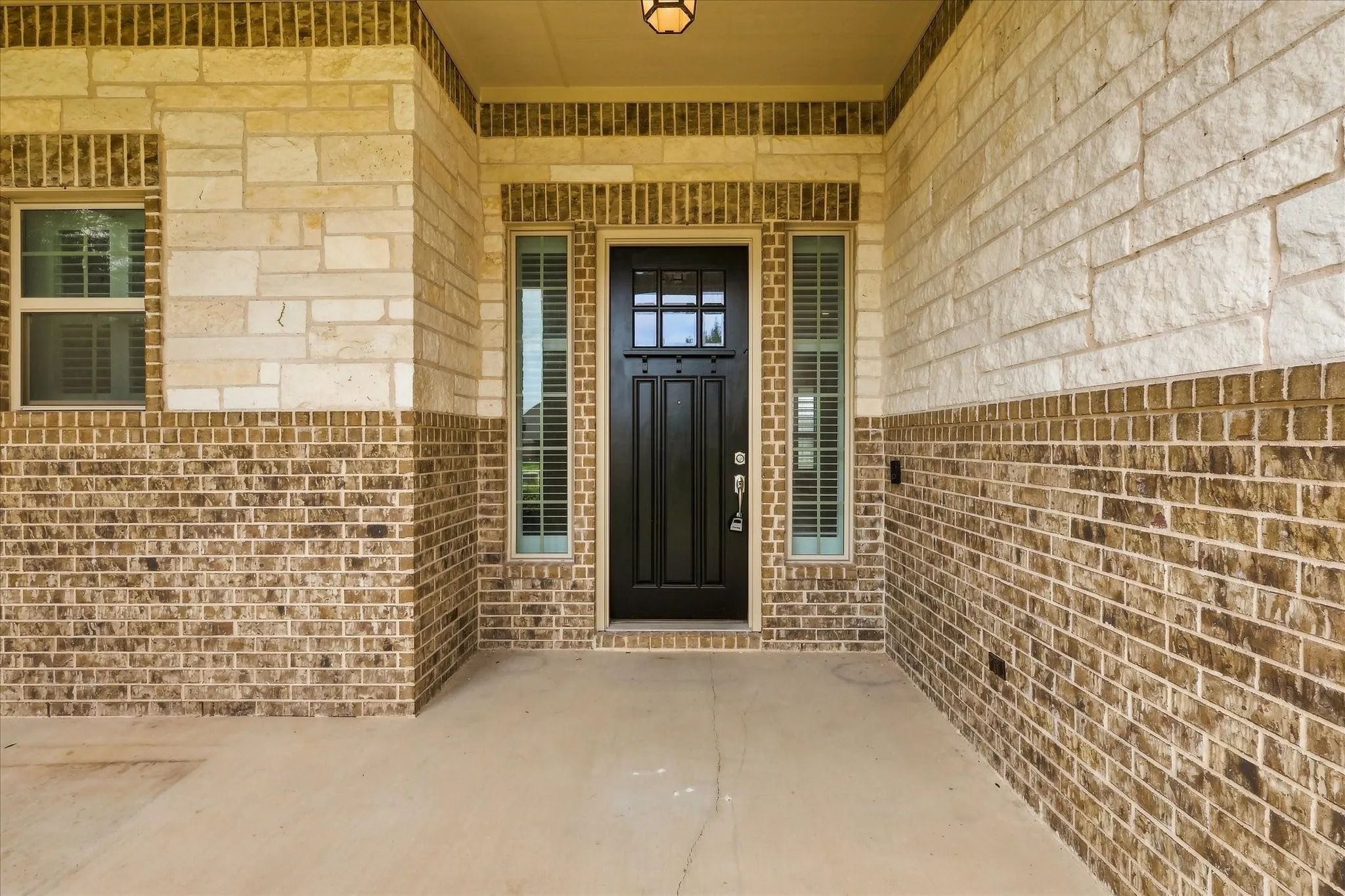 Large covered front patio. Perfect for enjoying morning coffee.