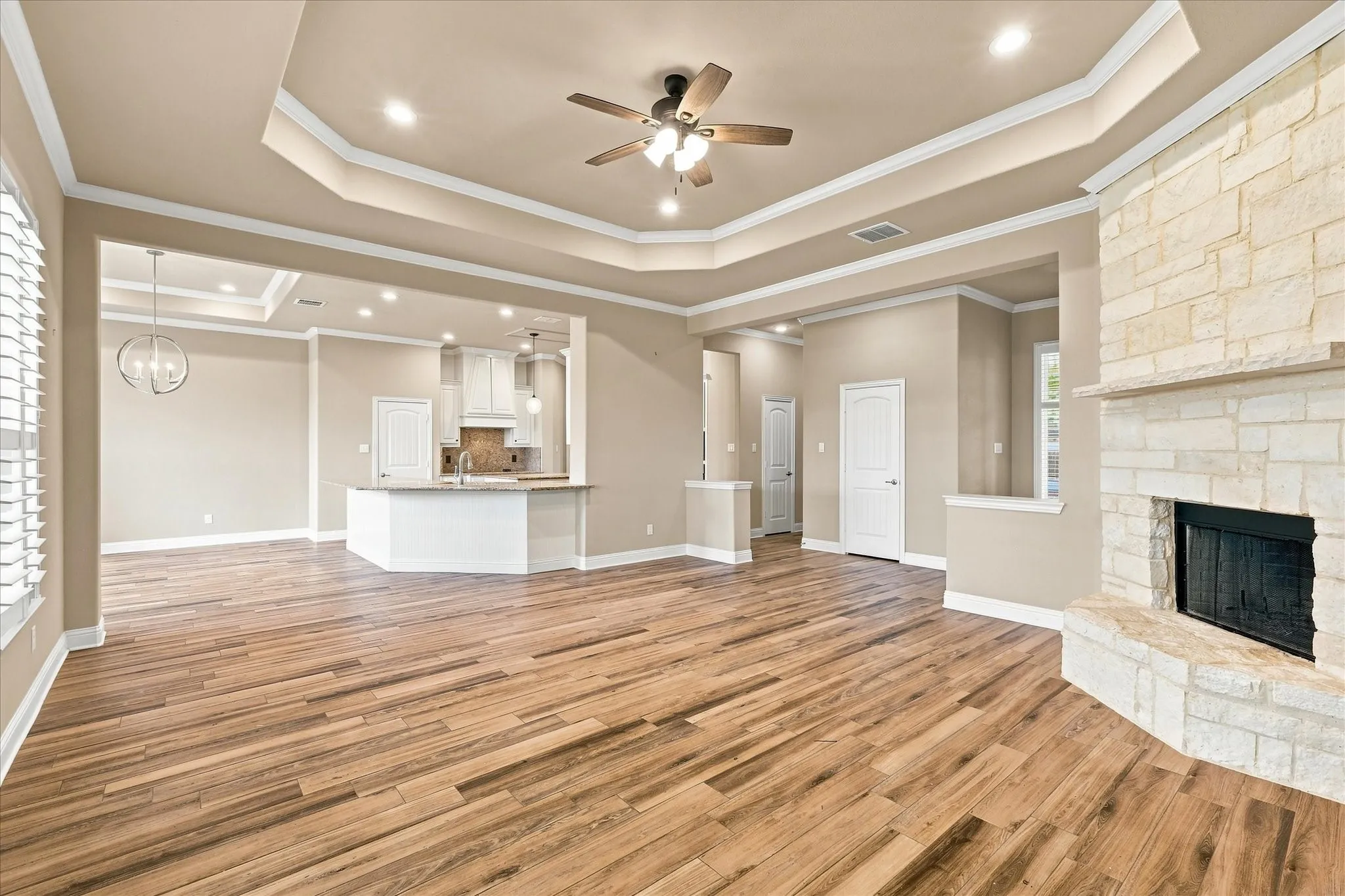 Living room open to dining area and kitchen.
