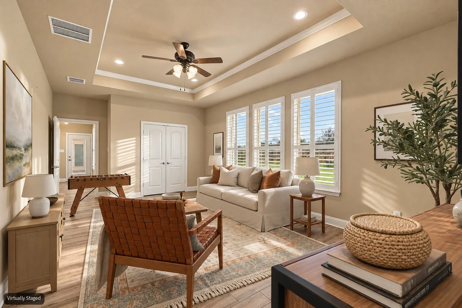 Virtually Staged. Game room behind dining area. Great flex space for a multitude or activities or could be used as a large 4th bedroom!