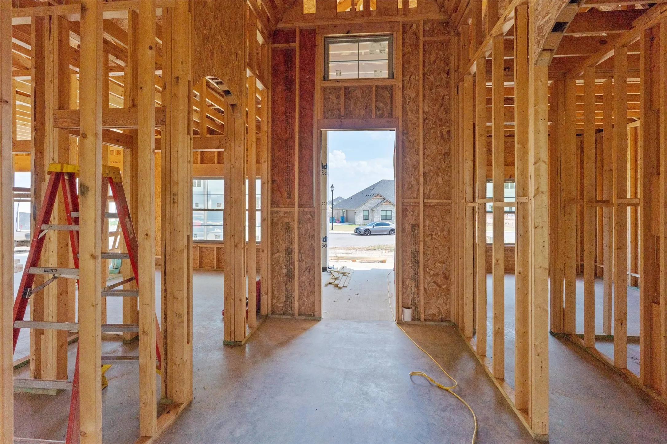 Open-concept framing with high ceilings and multiple window openings