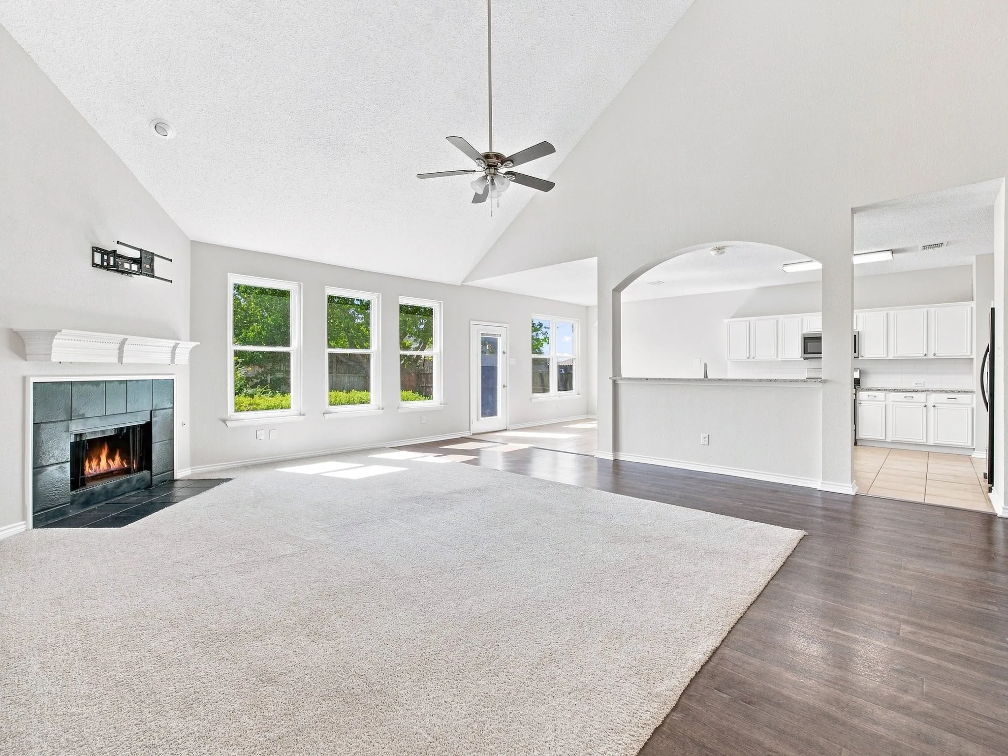 Living Room Overlooks Kitchen and Backyard
