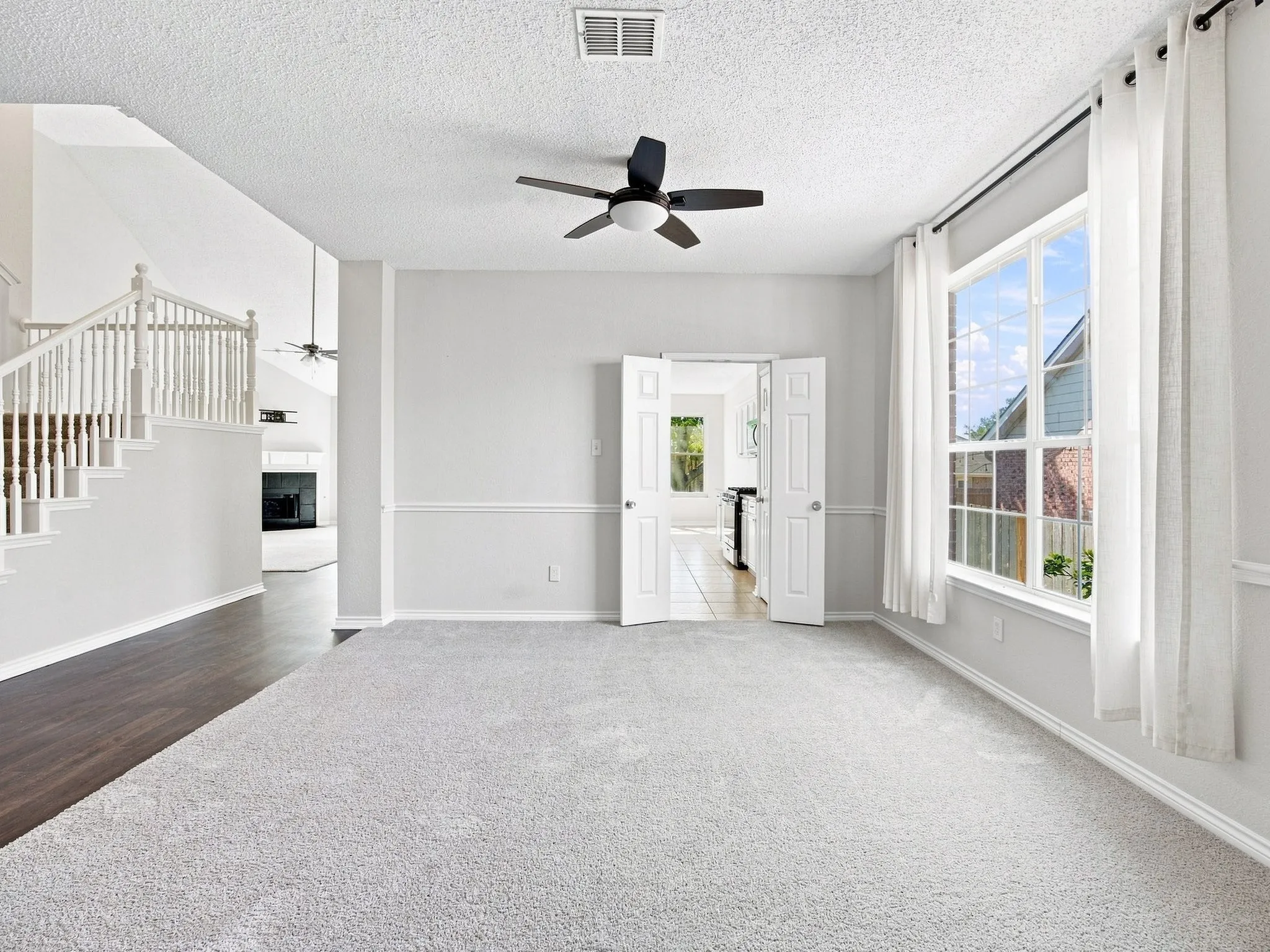 Large Formal Living and Dining Room off of the Kitchen