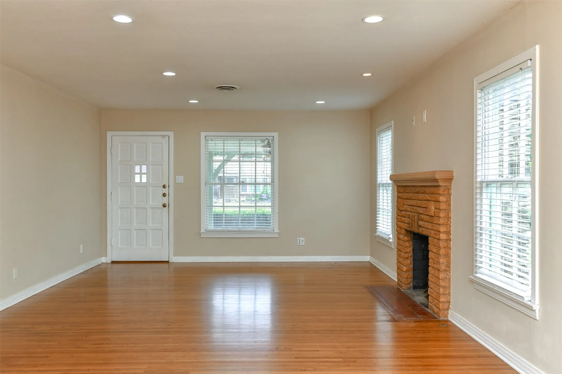 Unfurnished living room with light wood-type flooring