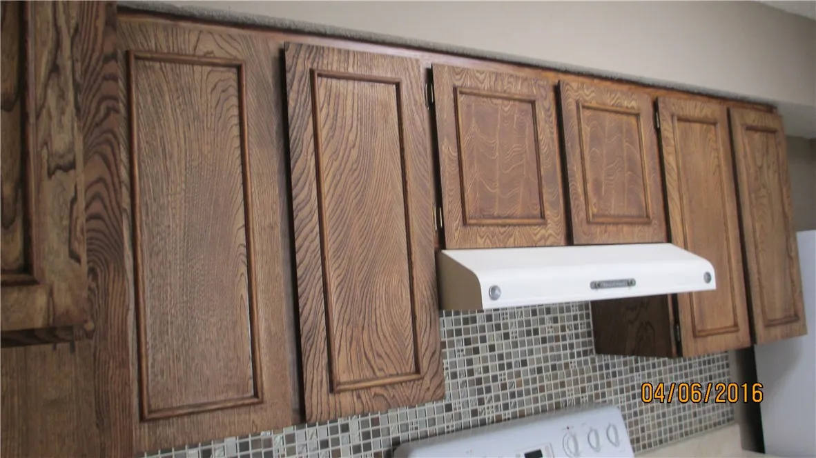 Refinished cabinets added back splash