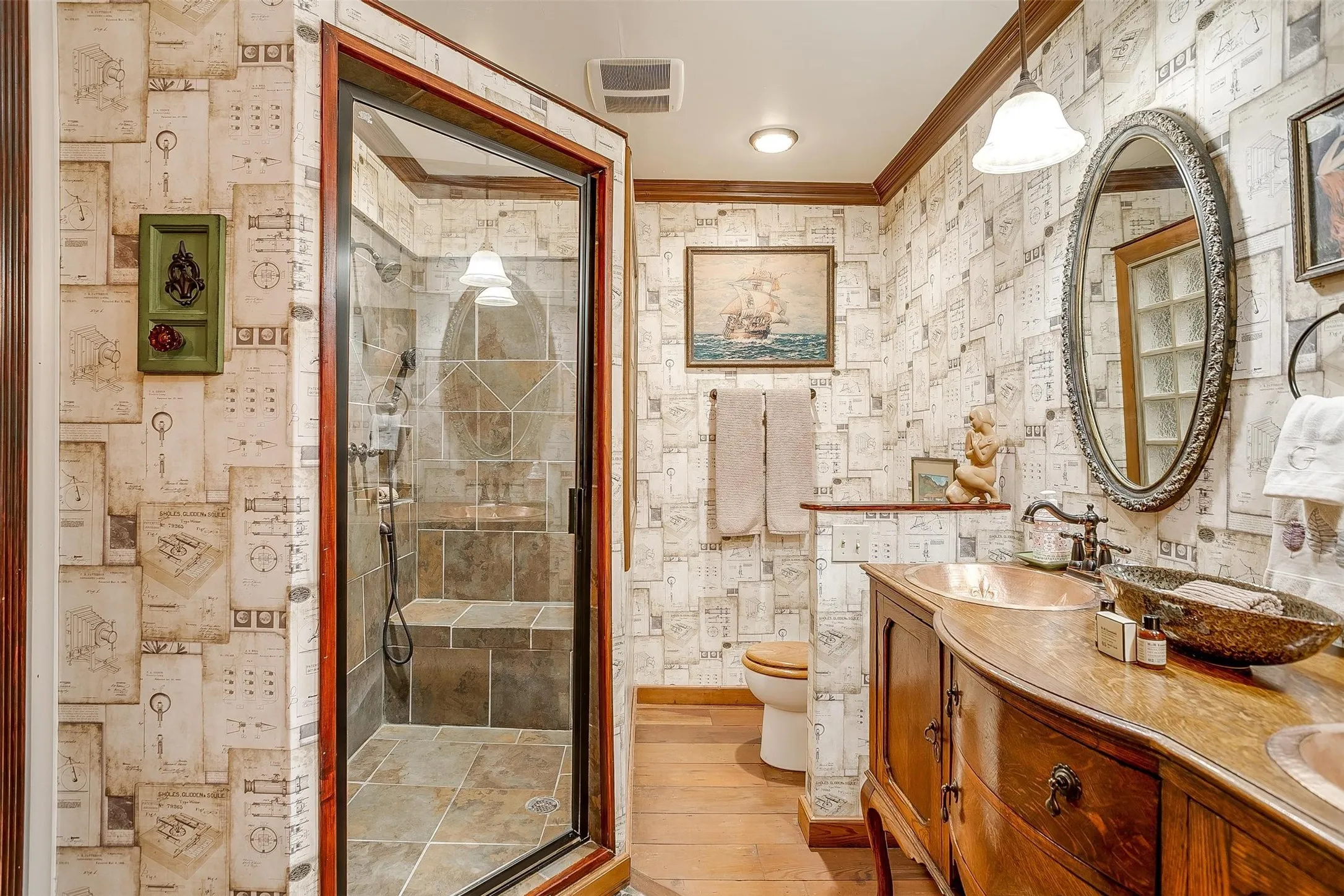custom bath with large walk in shower with bench, double vanity