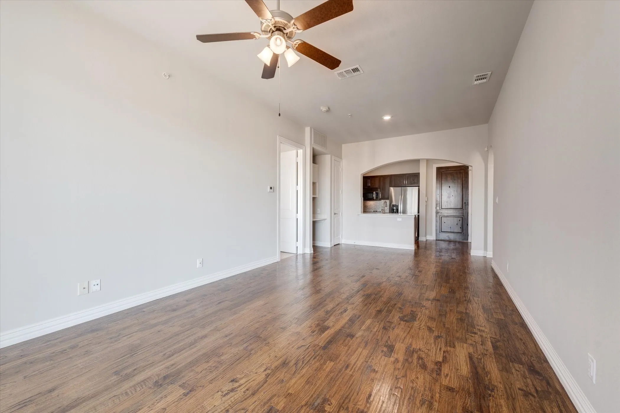 Wood-finish flooring throughout, complemented by light-toned wall finishes