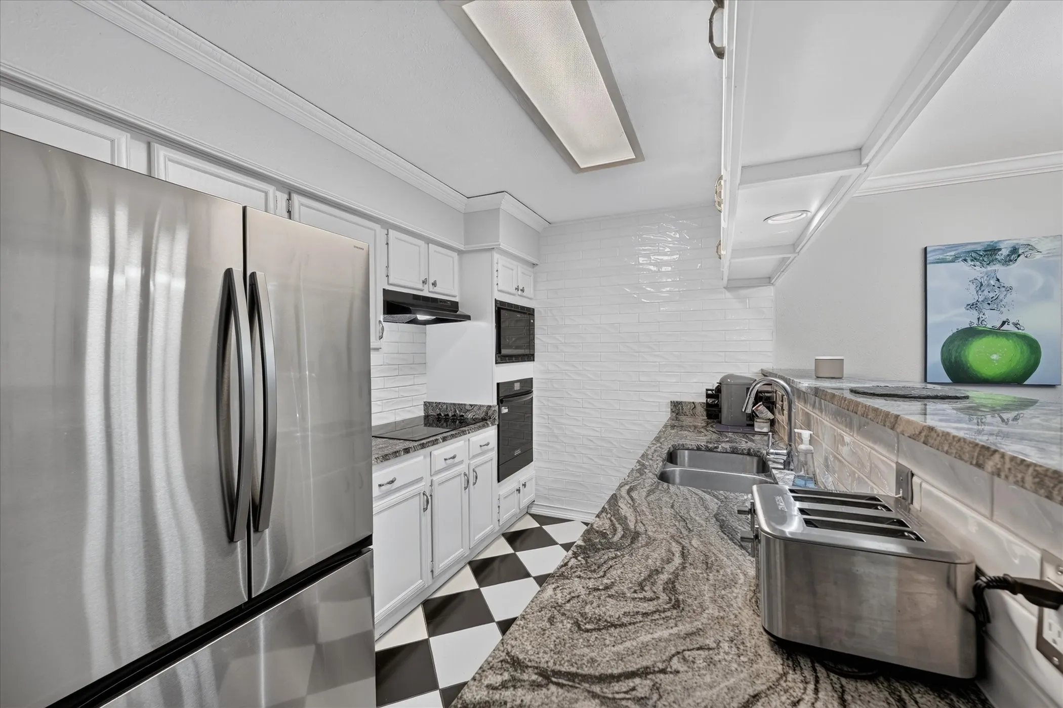 Kitchen udated with Stainless Samsung Fridge and Whirlpool appliances Granite counters and newly painted cabinets