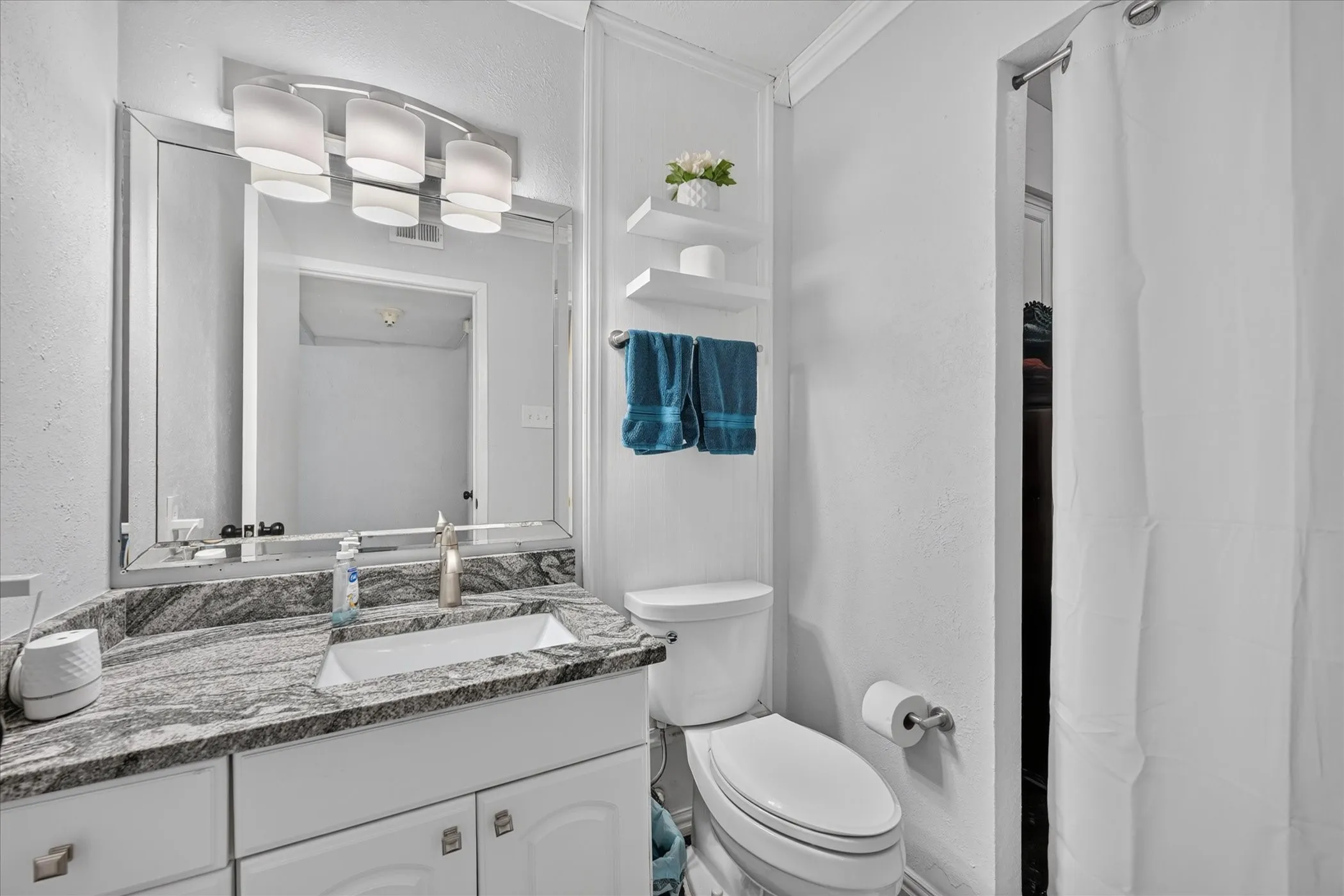 1/2 bath downstairs with Laundry room fully updated