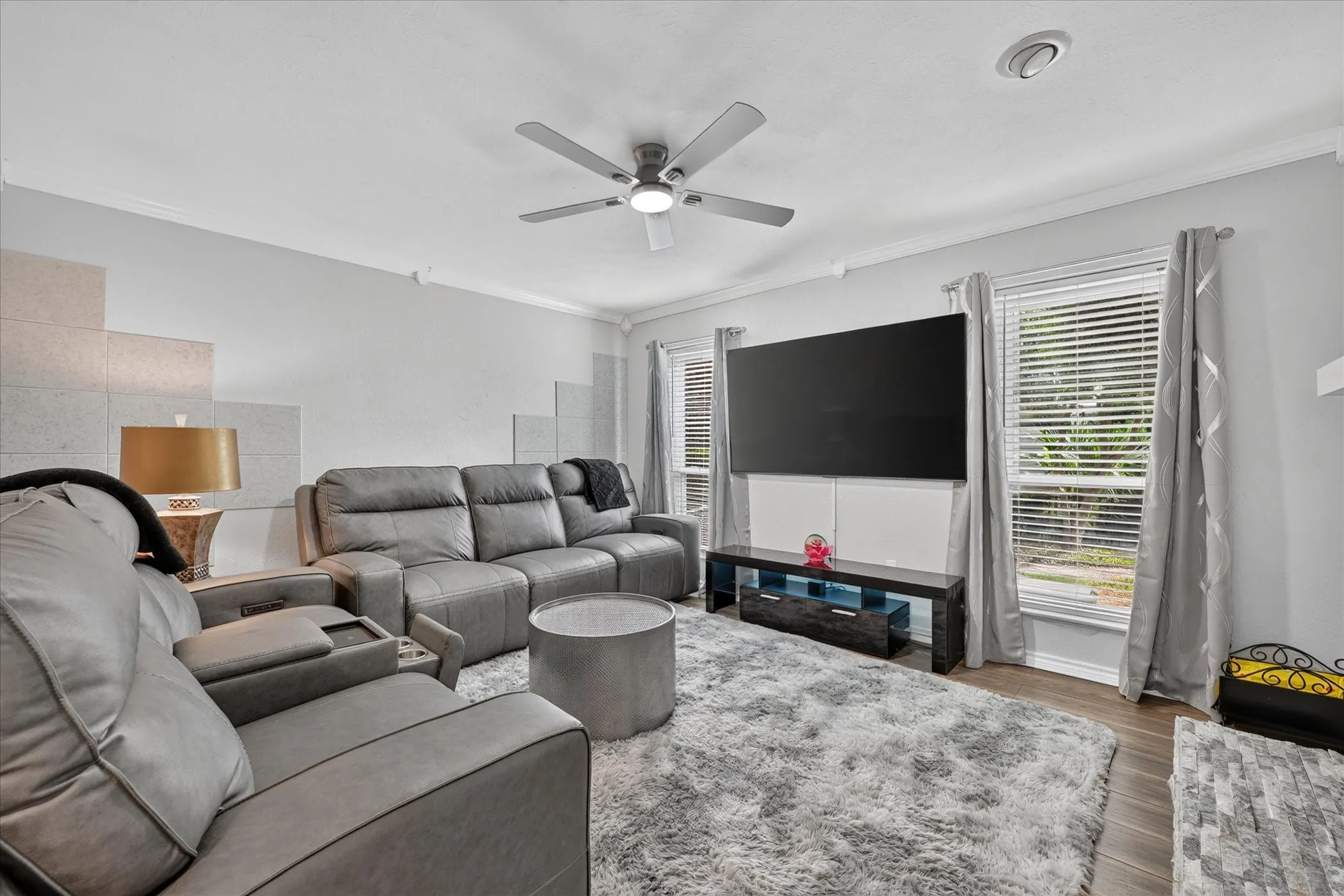 Living room with Two windows and FlatScreen TV and two new leather couches