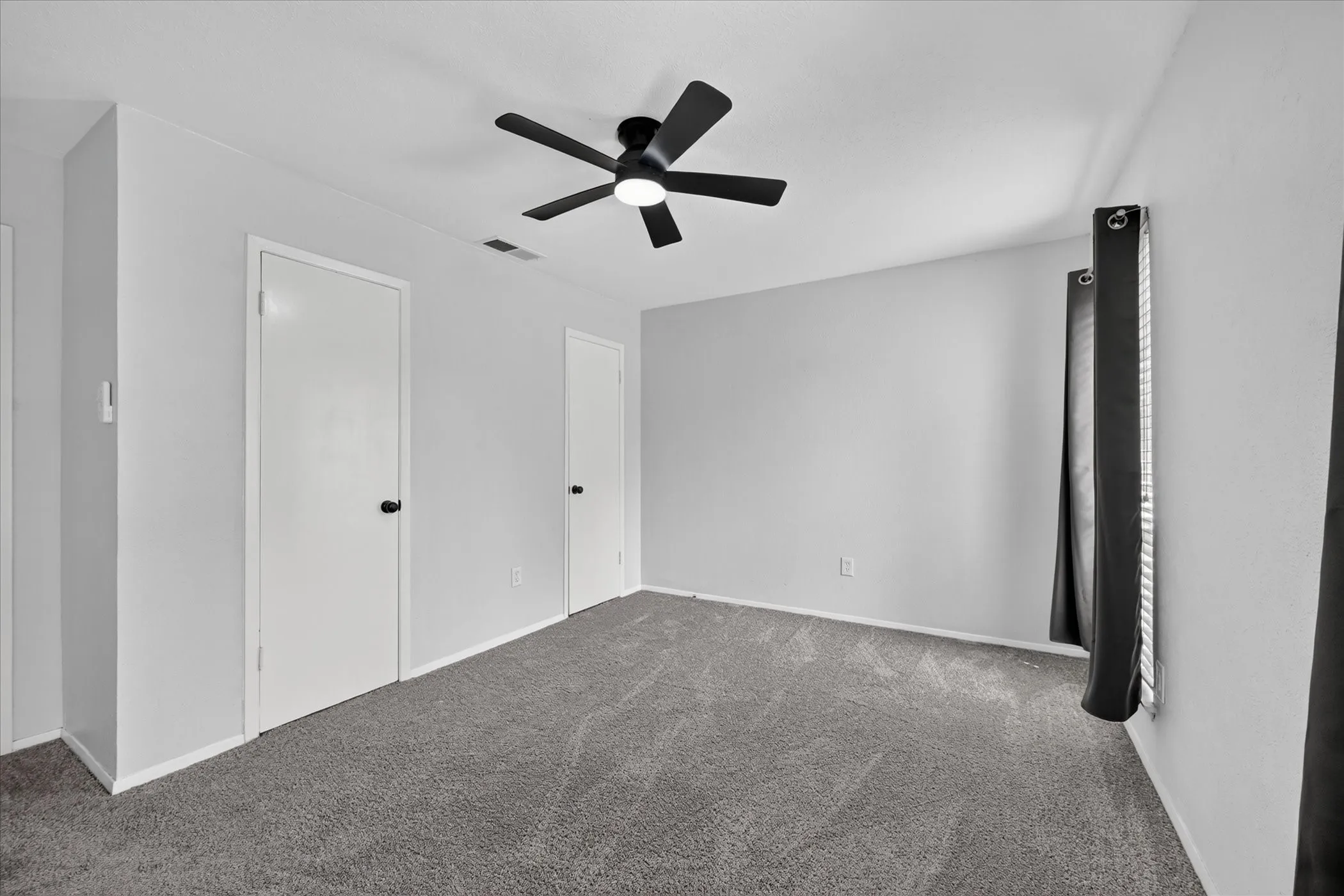 secondary bedroom with new ceiling fan