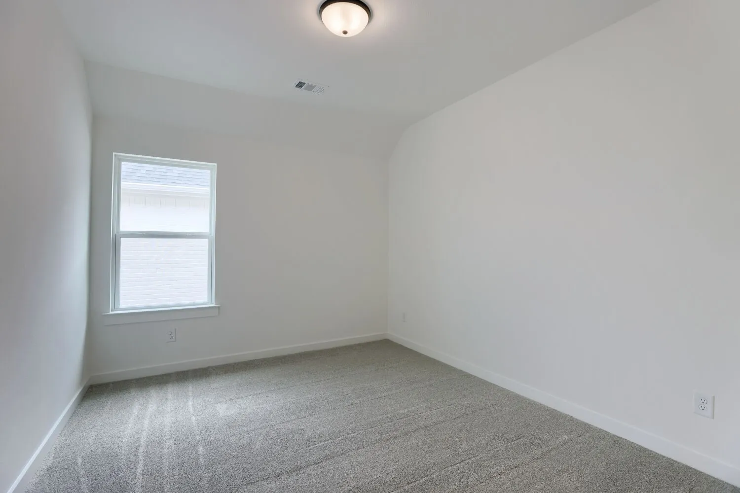 Neutral gray carpeting and white walls
