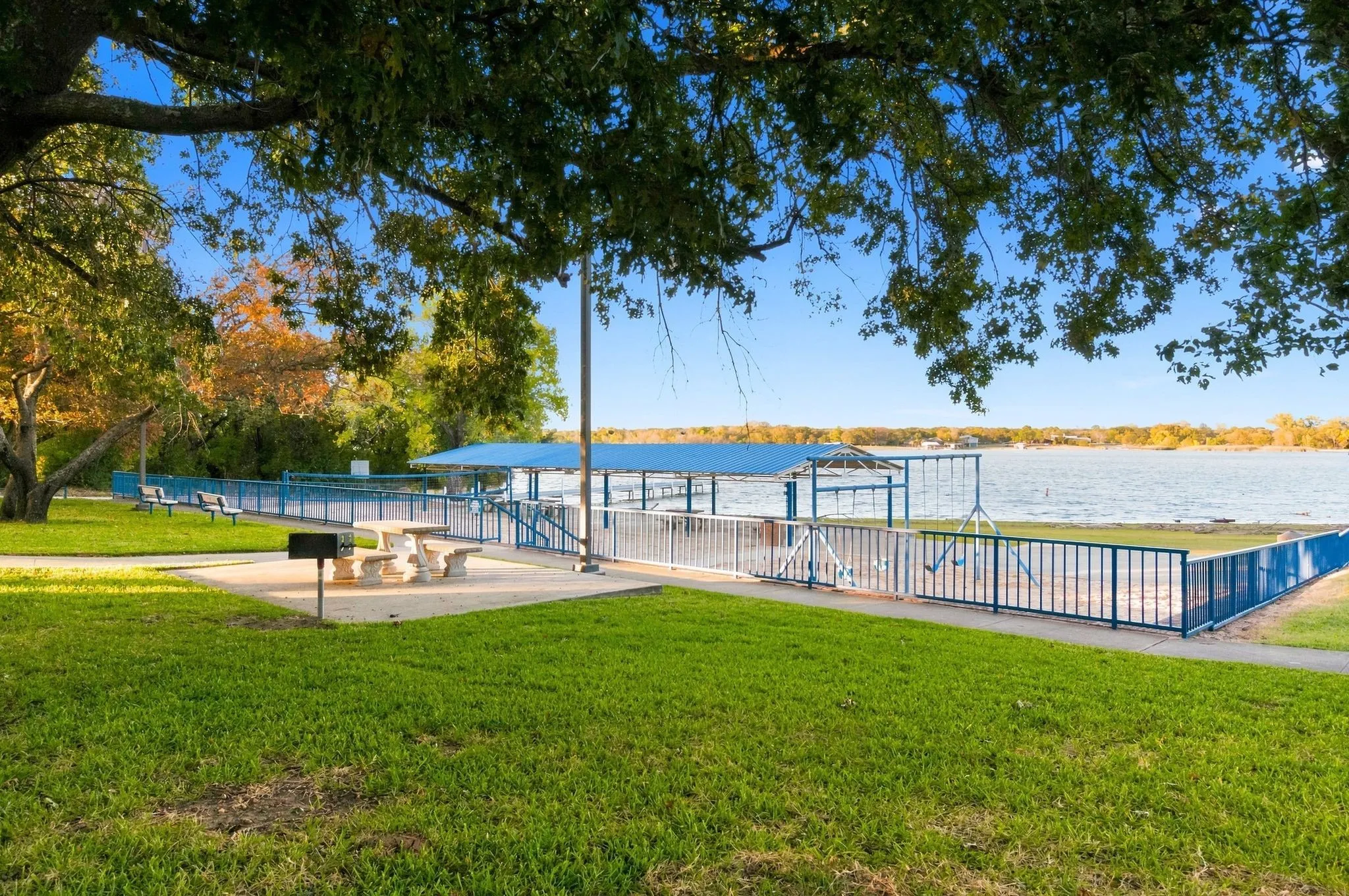 Community Park With Sandy Beach, Sitting Area and Boat Ramps.