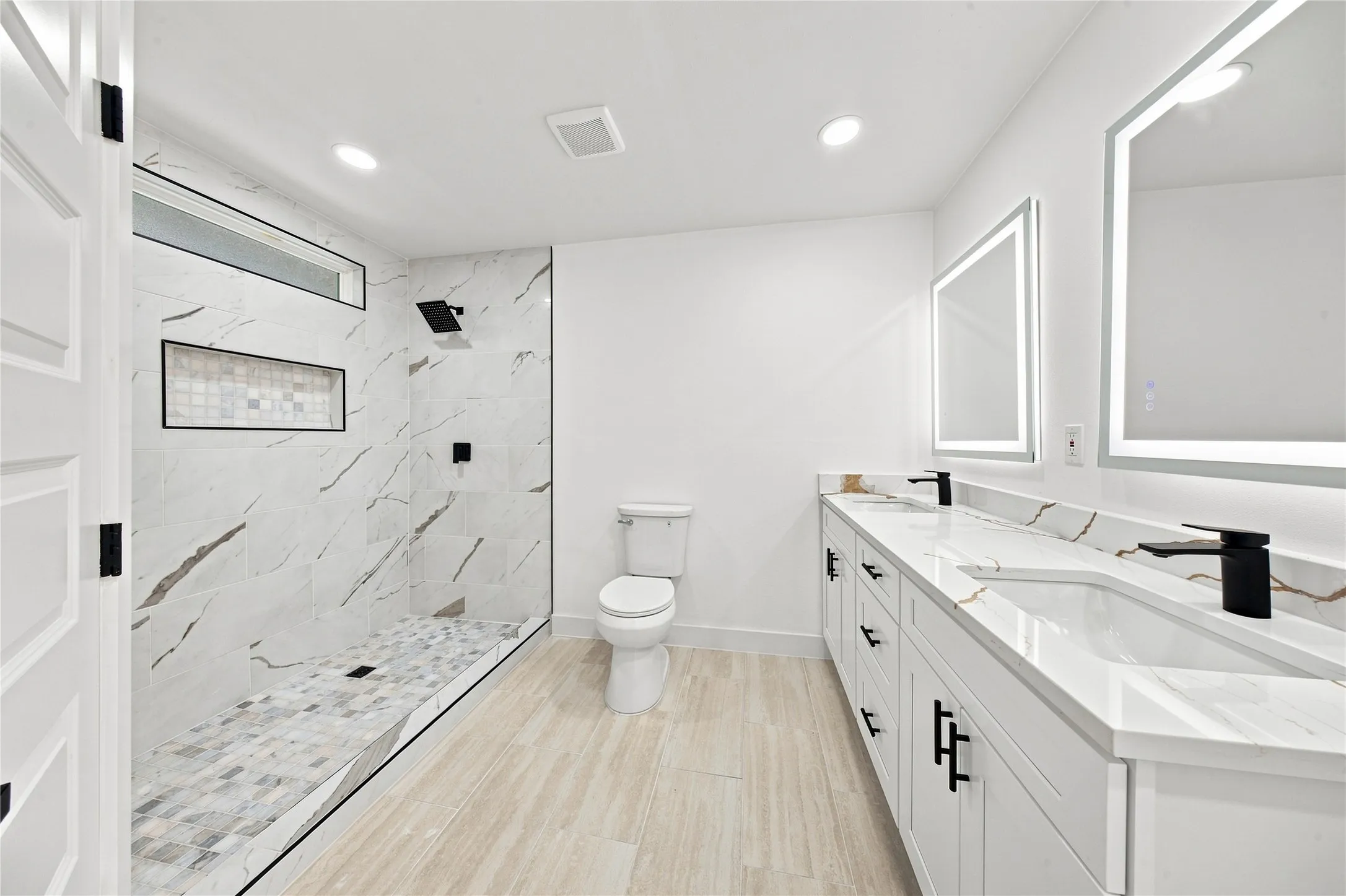 Dual vanity with integrated sinks and black matte fixtures