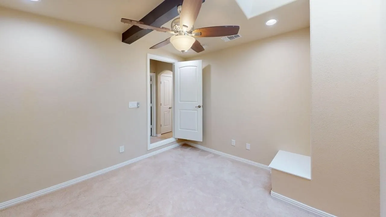 Wall-to-wall carpeting, recessed lighting, and a ceiling fan with integrated light