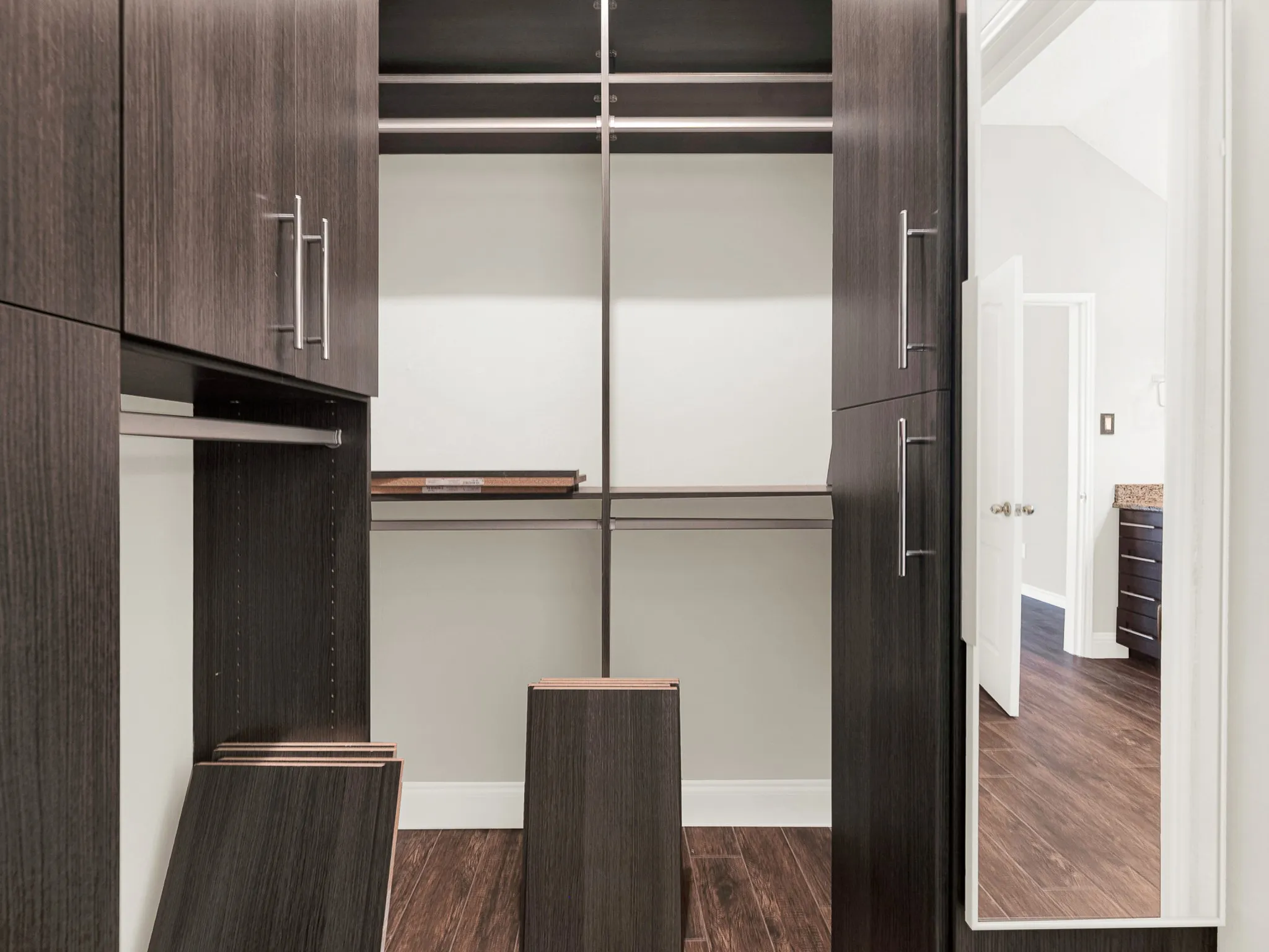 Primary closet has custom storage.