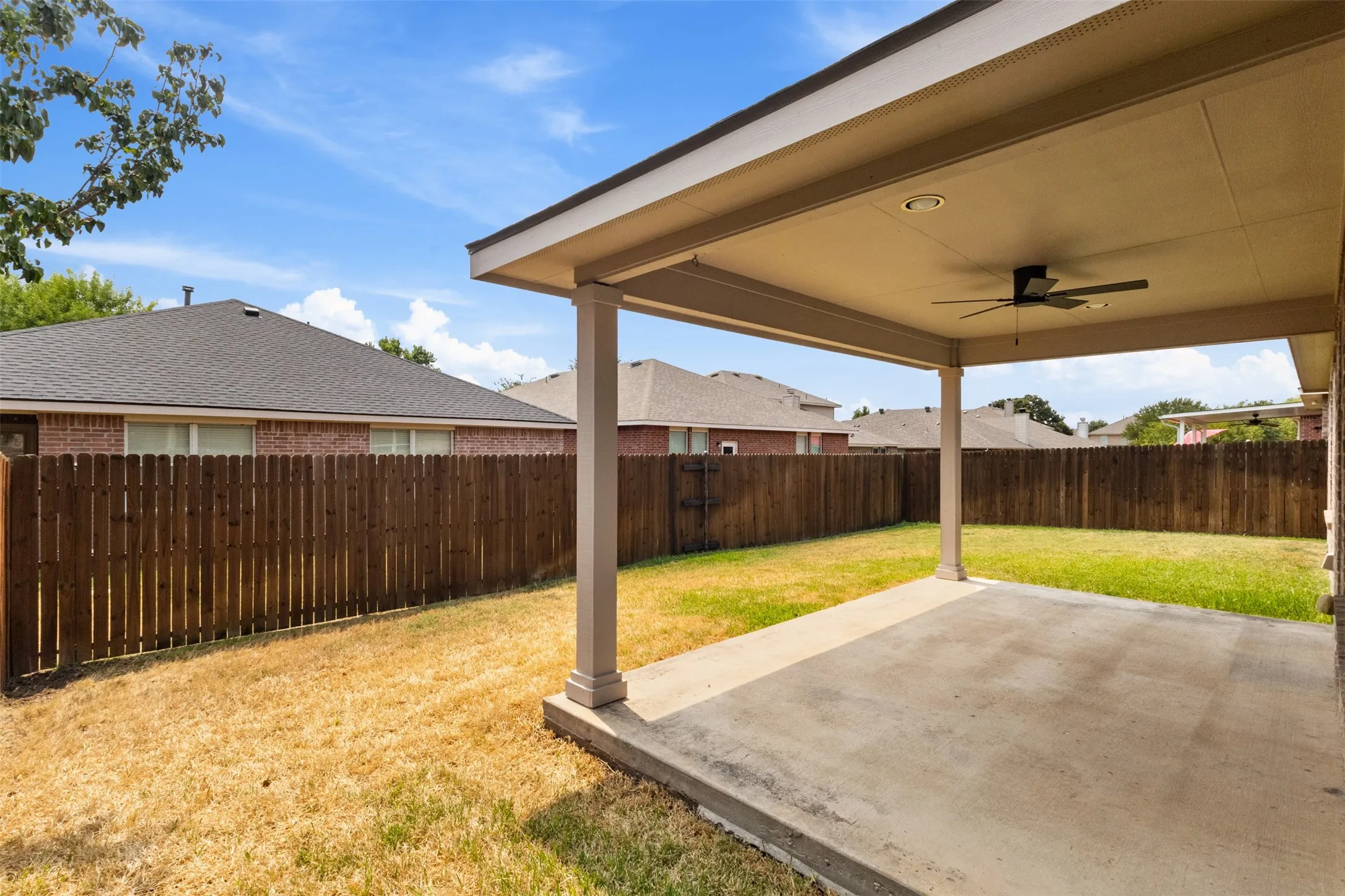 Covered patio with a concrete slab, recessed lighting, and a ceiling fan