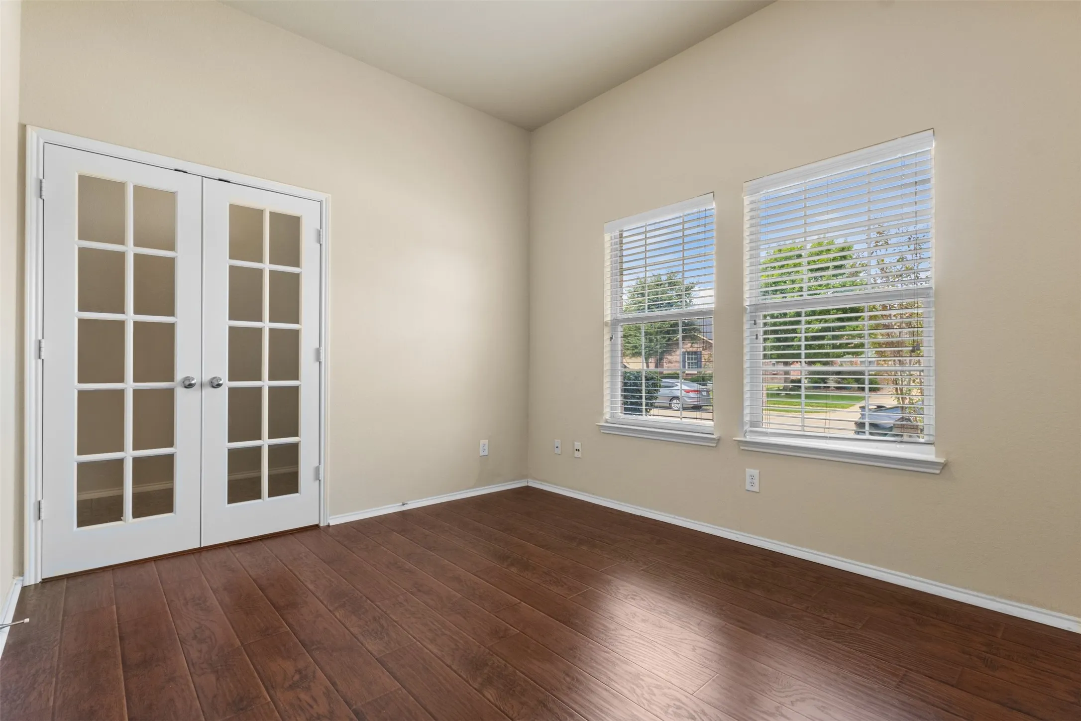 Wood-finish flooring throughout, paired with neutral wall tones