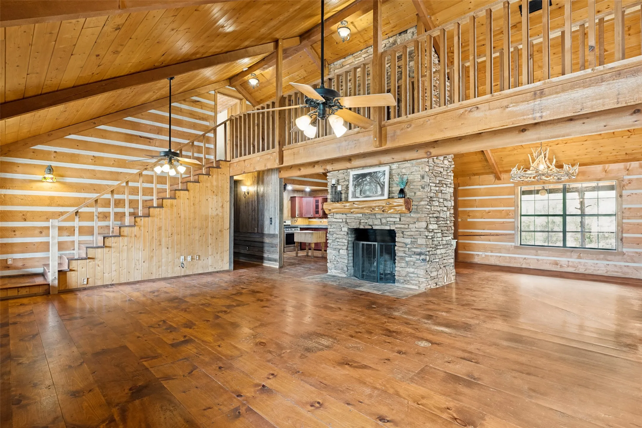 Spacious Living Room with Rock Fireplace