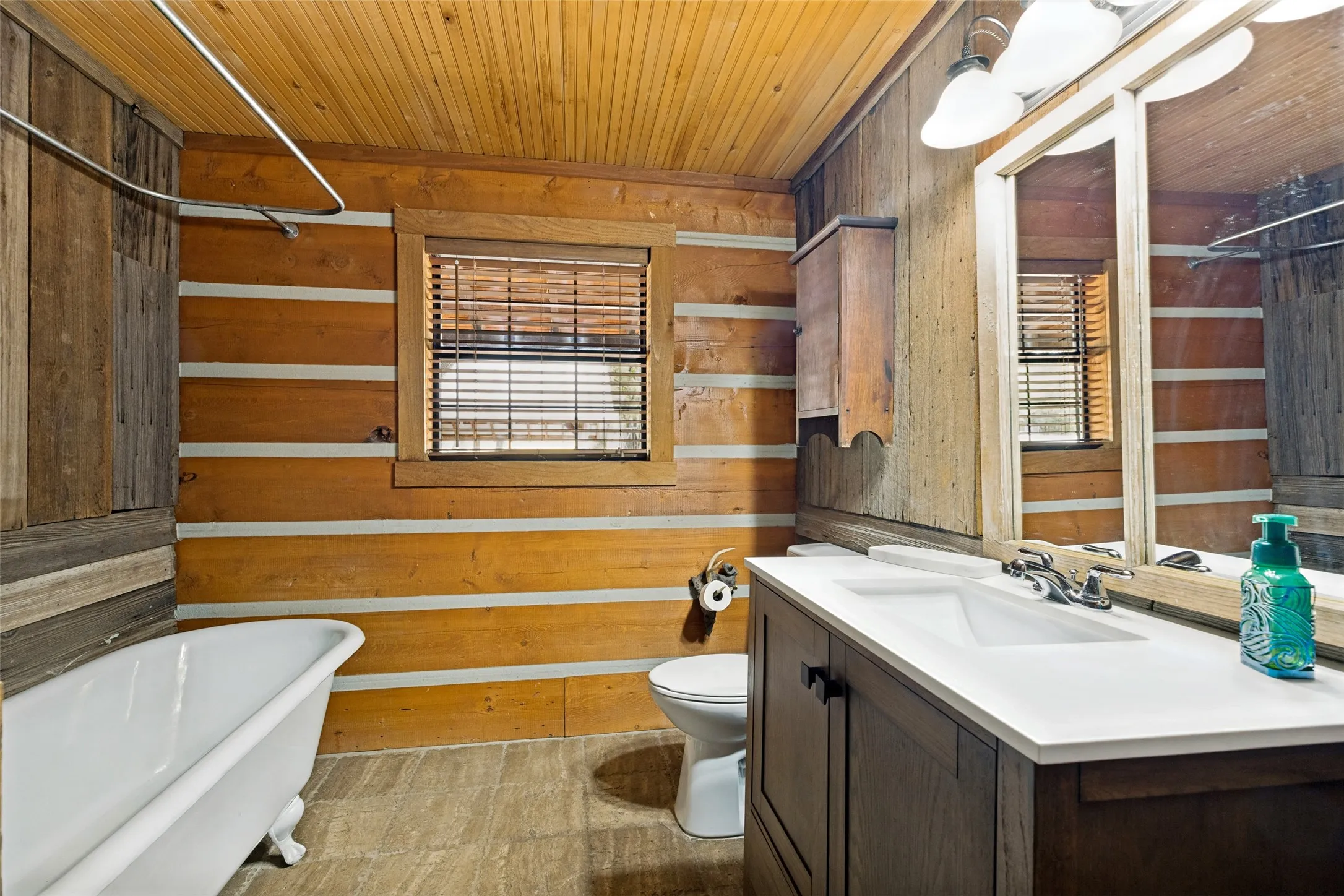 Guest Bedroom Downstairs with Claw Foot Tub and Antique Linen Closet and Cabinet