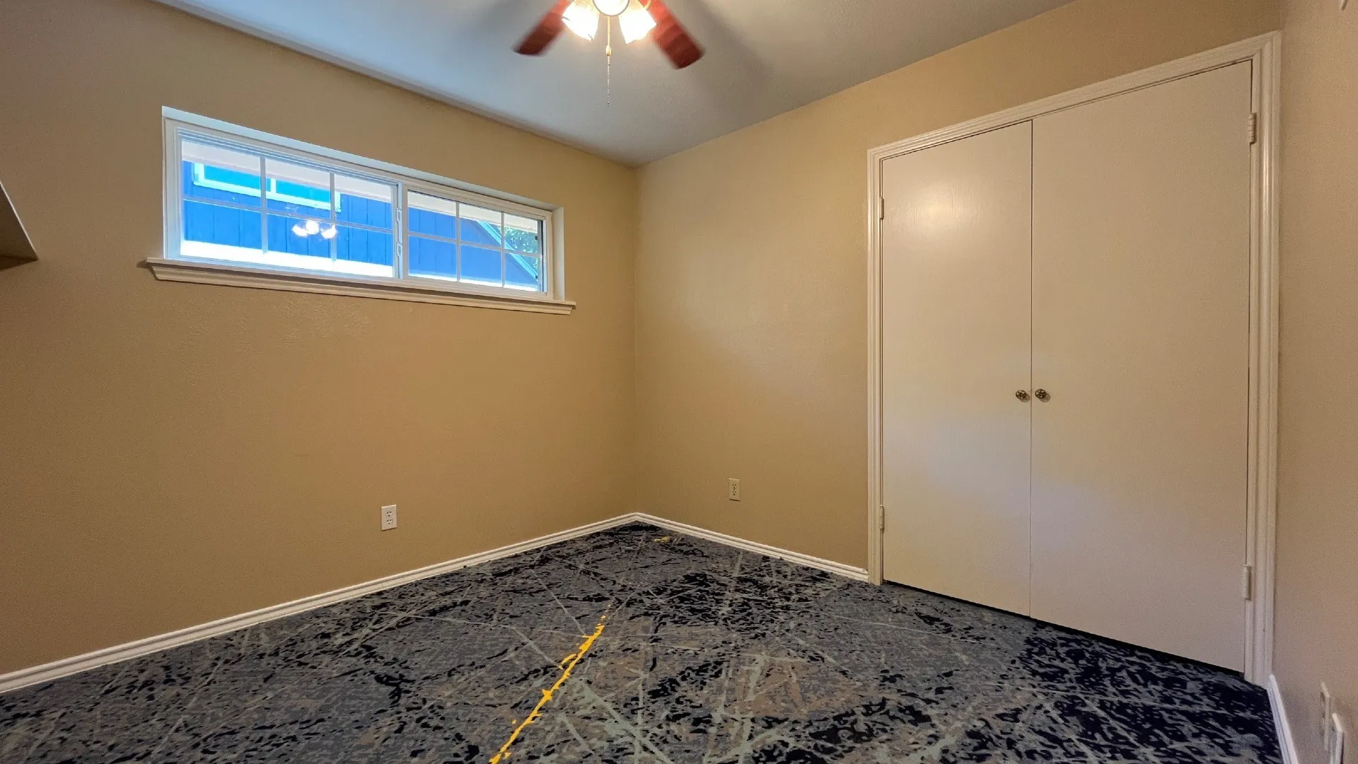 Recessed window, ceiling fan, and bi-fold closet doors
