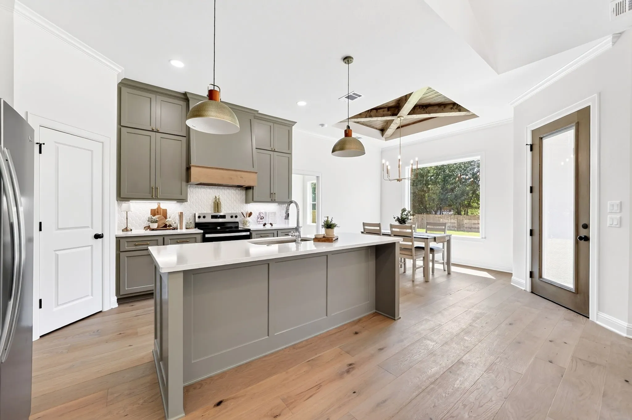 The kitchen features high end cabinetry & stainless steel appliances.