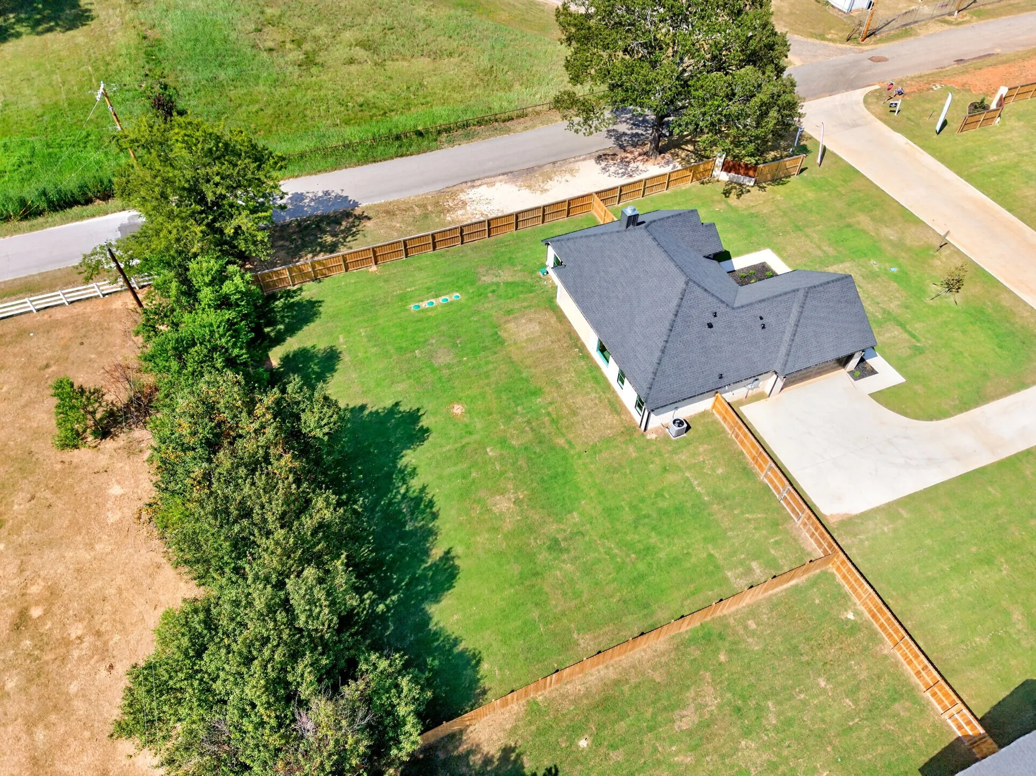 Aerial view of 302 Grace lane, a high end, transitional style, new construction home on half acre lot (.50) intentionally designed to add a site built shop or pool.