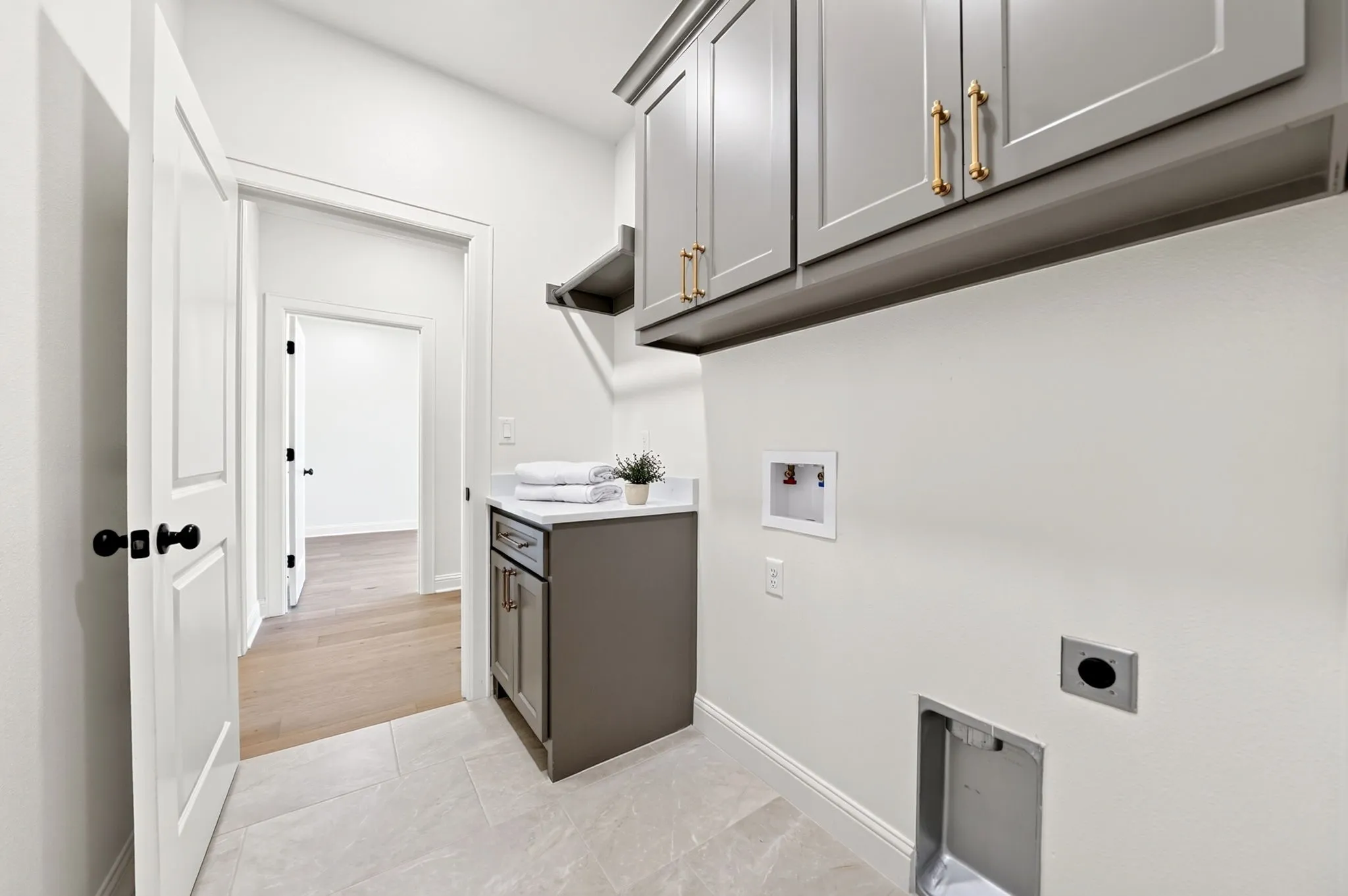 Laundry room with views of the 4th bedroom.