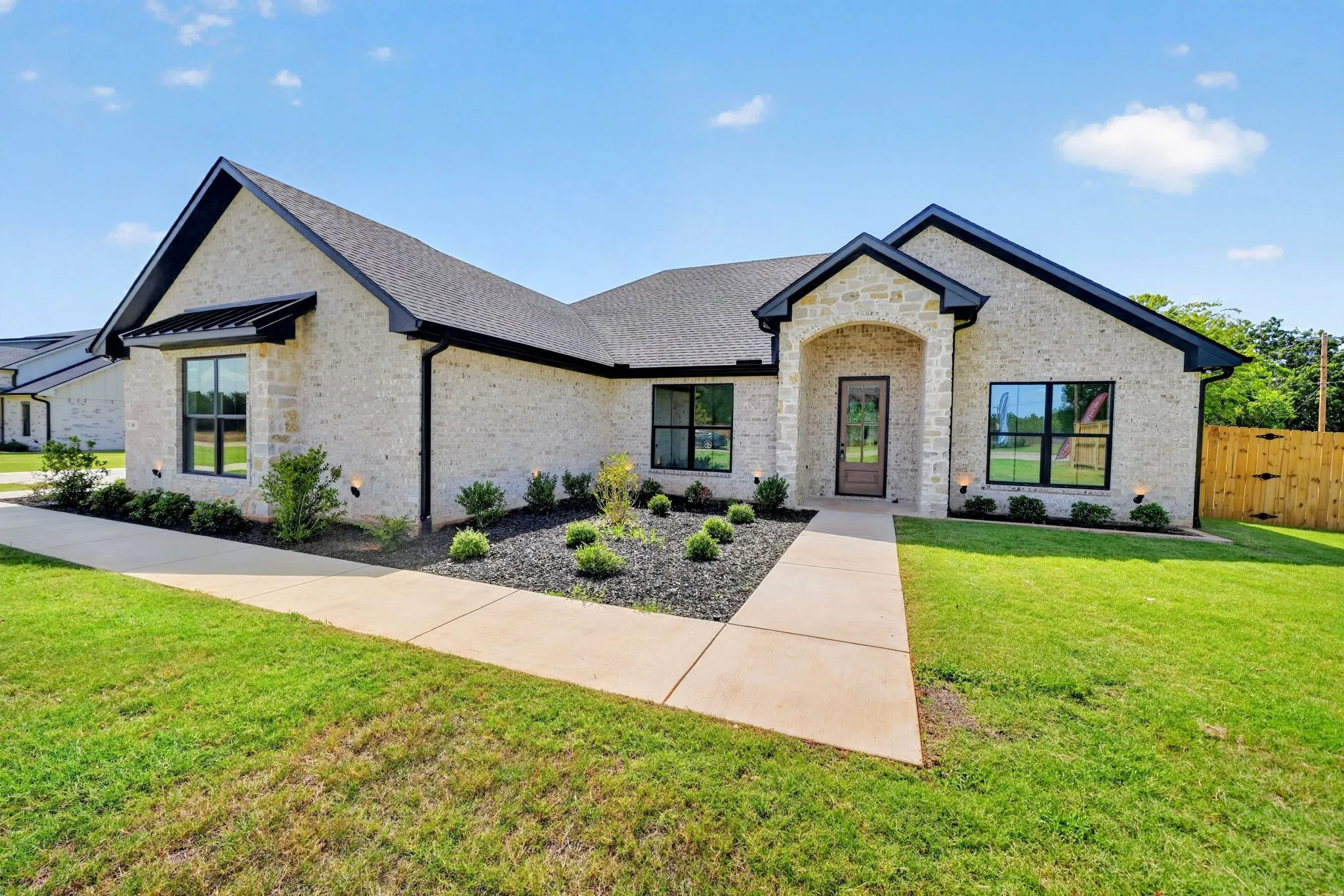 Front entrance of 302 Grace Lane, Athens, Texas, a new construction 4 bedroom home in Fulligim's Grace Haven. A brand new subdivision located outside city limits.