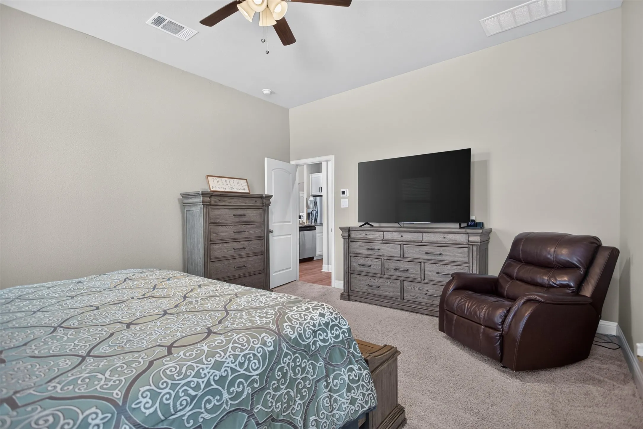 Wall-to-wall carpeting and neutral wall paint