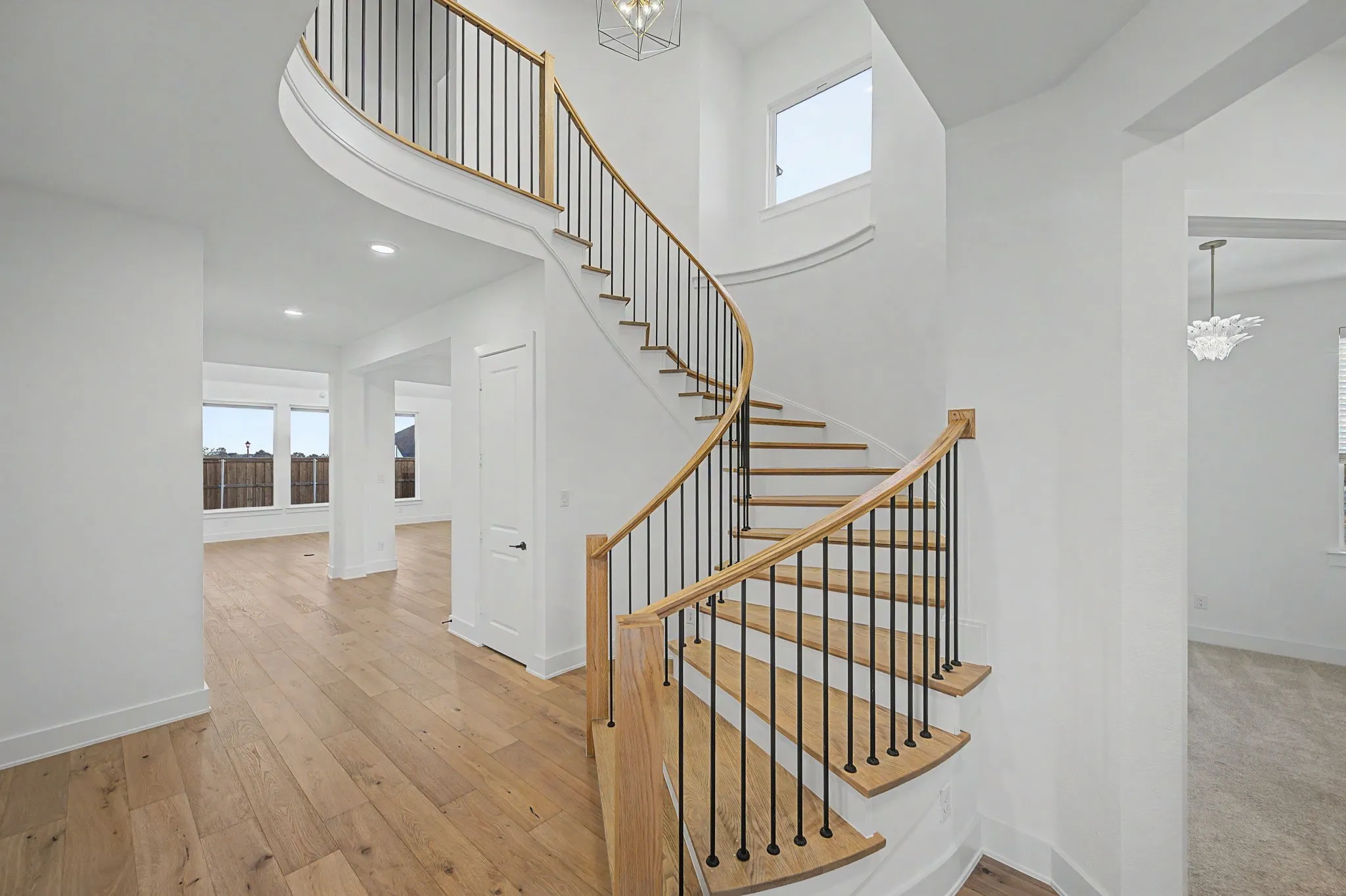 Soaring ceilings as you walk in the door with this beautiful winding staircase