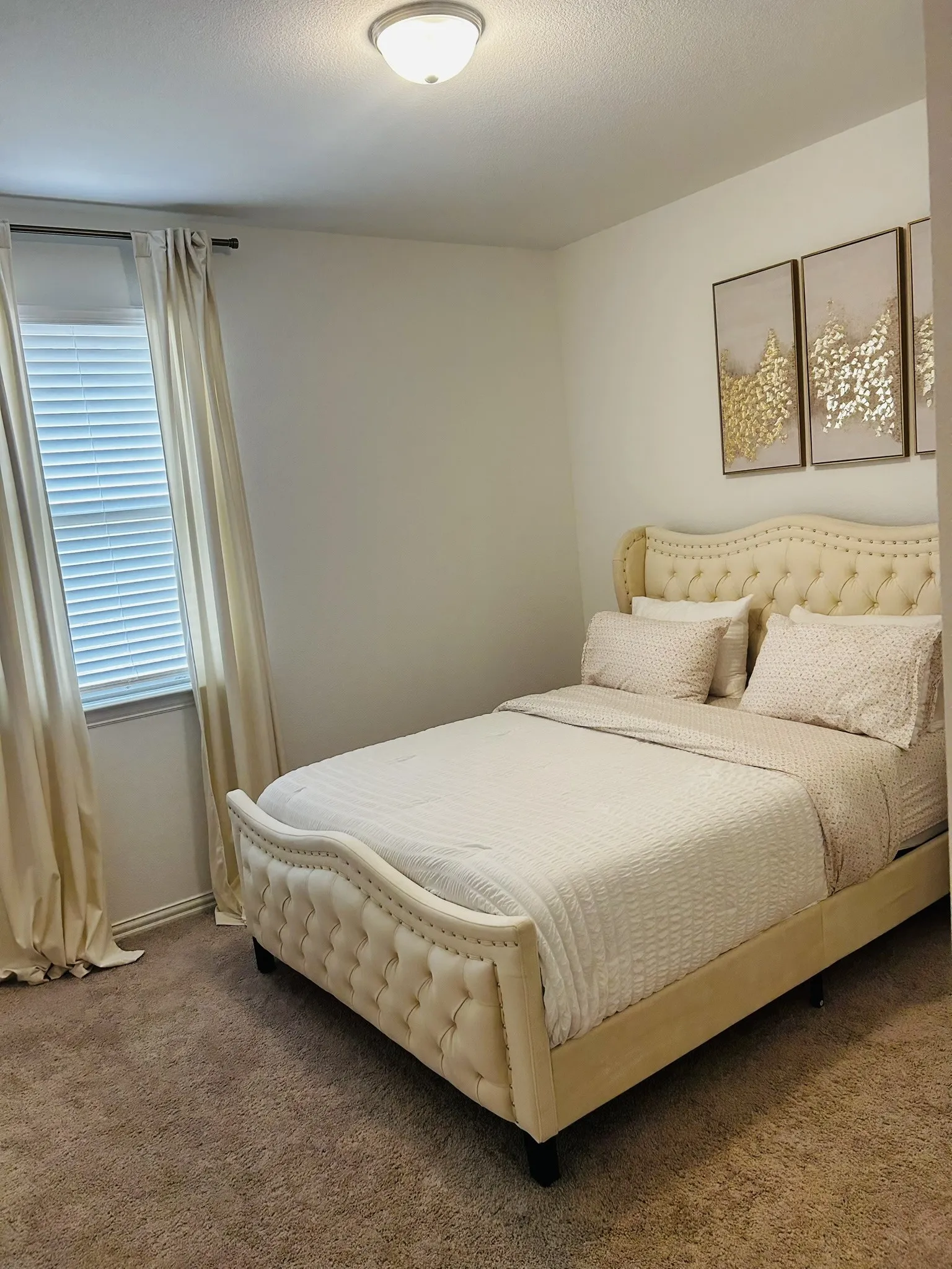 Recessed ceiling light fixture, wall-to-wall carpeting, and a window with blinds