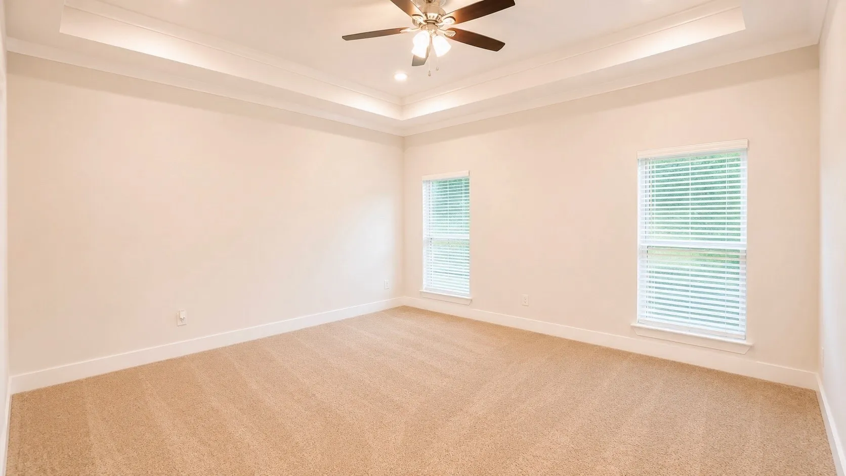 Recessed ceiling with crown molding and ceiling fan