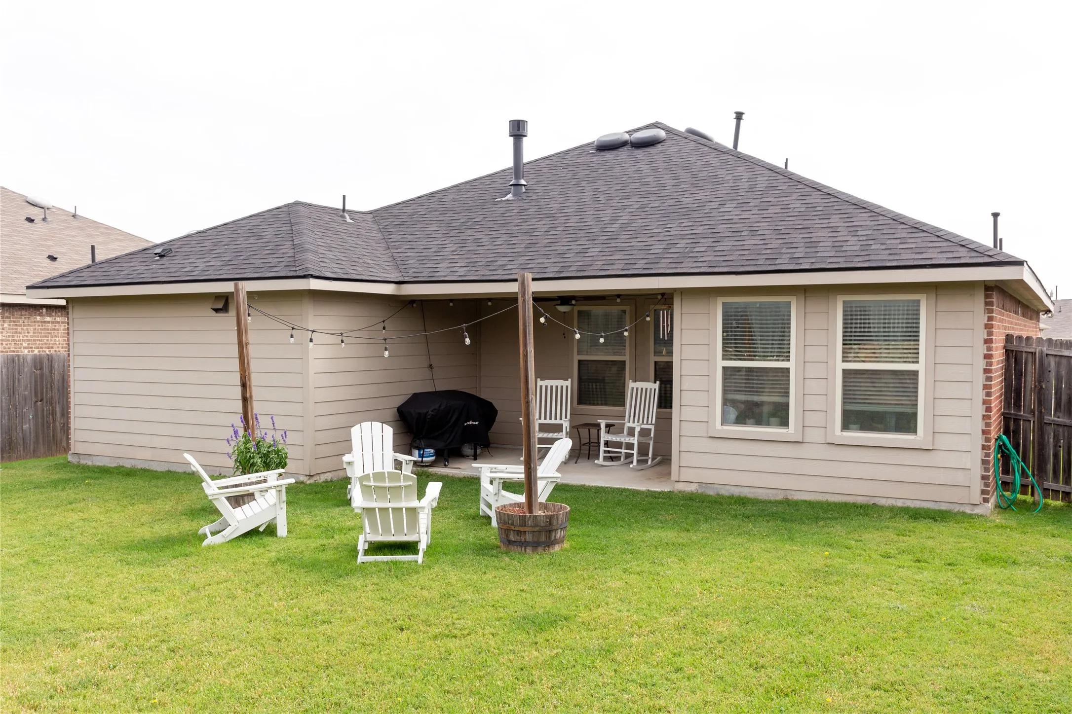 Large backyard with covered patio