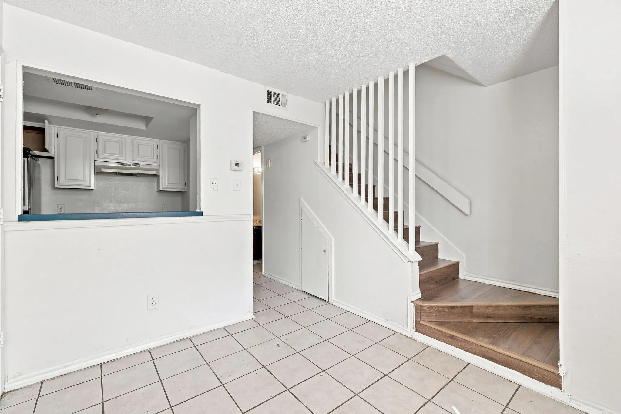 Vacant Unit 13 – Dining Area and Stairway