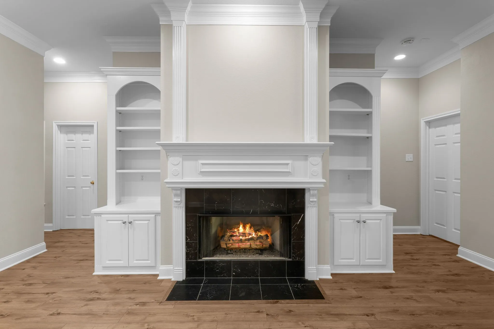 Fireplace featuring a black stone surround and hearth