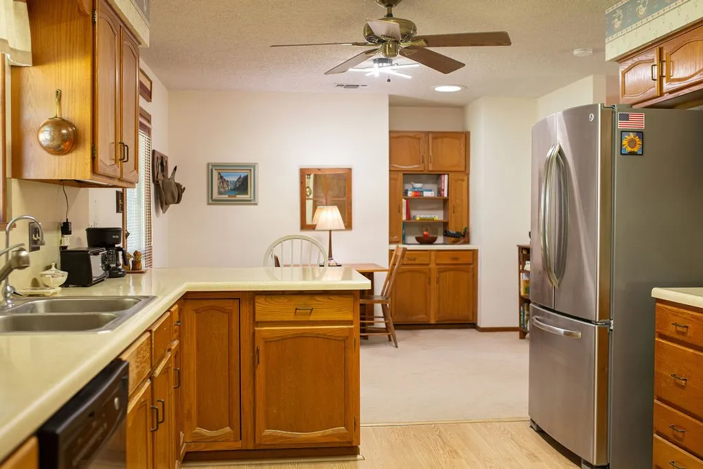 Neutral-toned countertops complementing wood cabinetry