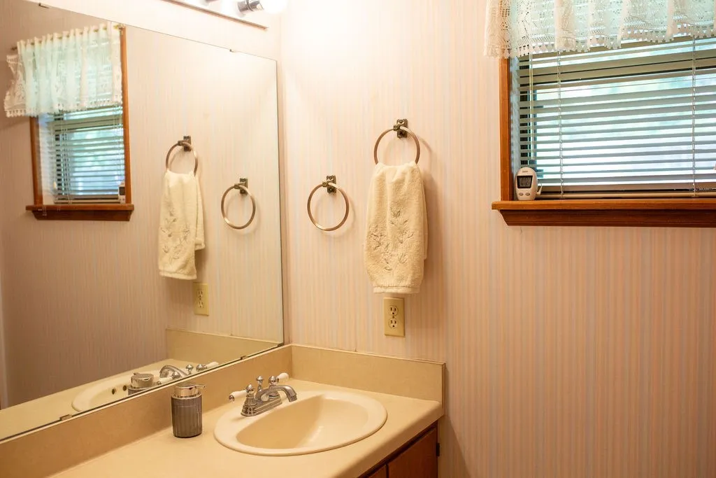 Single vanity with an integrated sink and chrome faucet