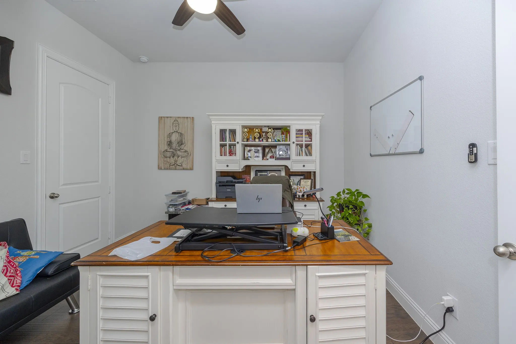 Recessed lighting, ceiling fan, wood-finish flooring, white paneled door, built-in desk with hutch