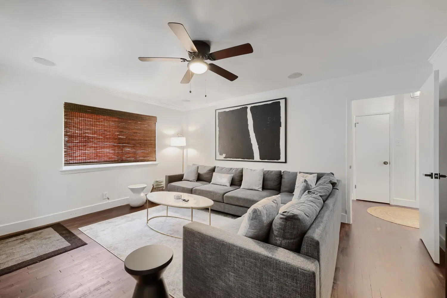 Recessed lighting, wood-finish flooring, ceiling fan, crown molding, and white interior doors