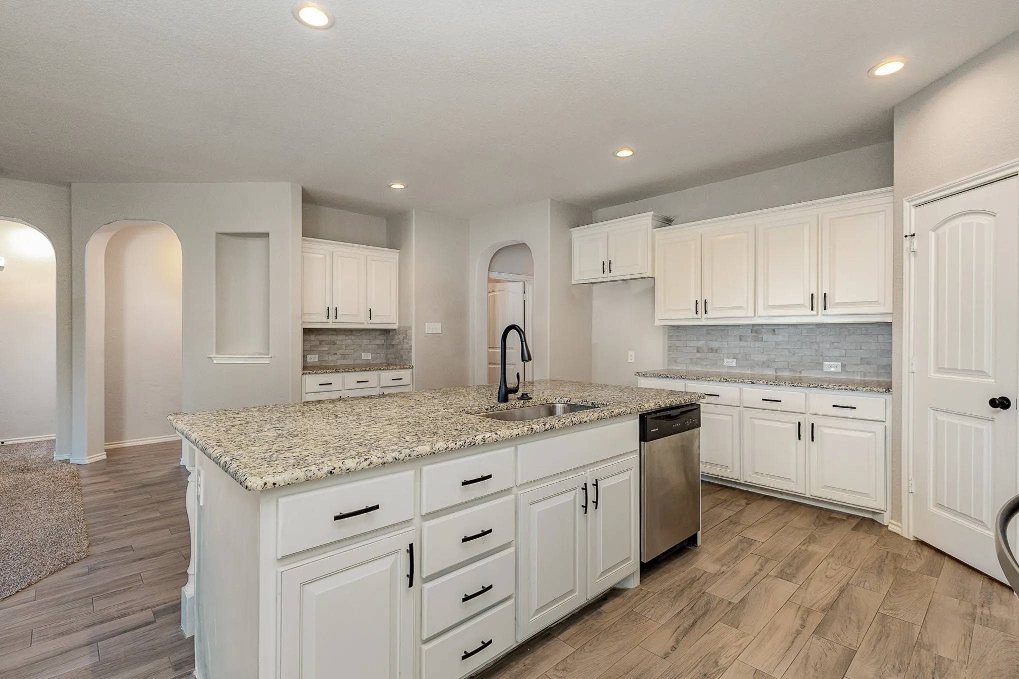 Open floorplan, large kitchen with plenty of counter space and cabinets.