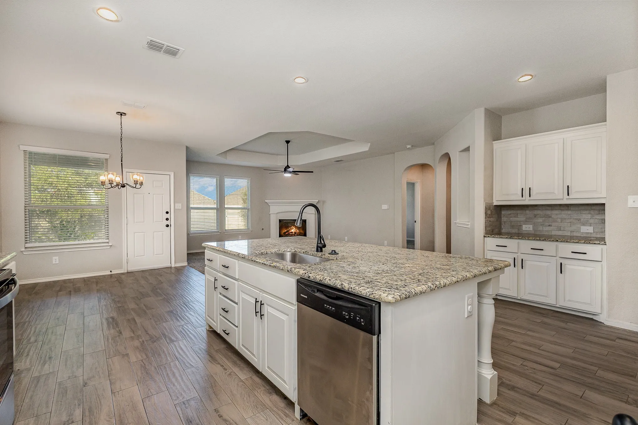 Open floorplan. View of great room: kitchen, dining area and living room