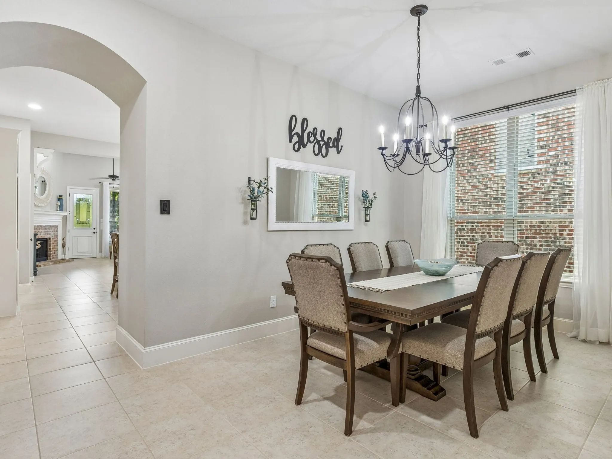 Neutral tone wall paint with an arched doorway.