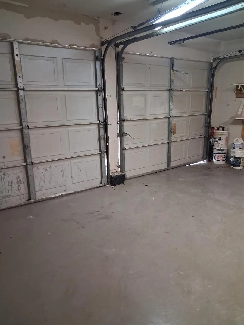 DOUBLE CAR GARAGE WITH PLENTY OF STORAGE AND DOOR TO BACKYARD